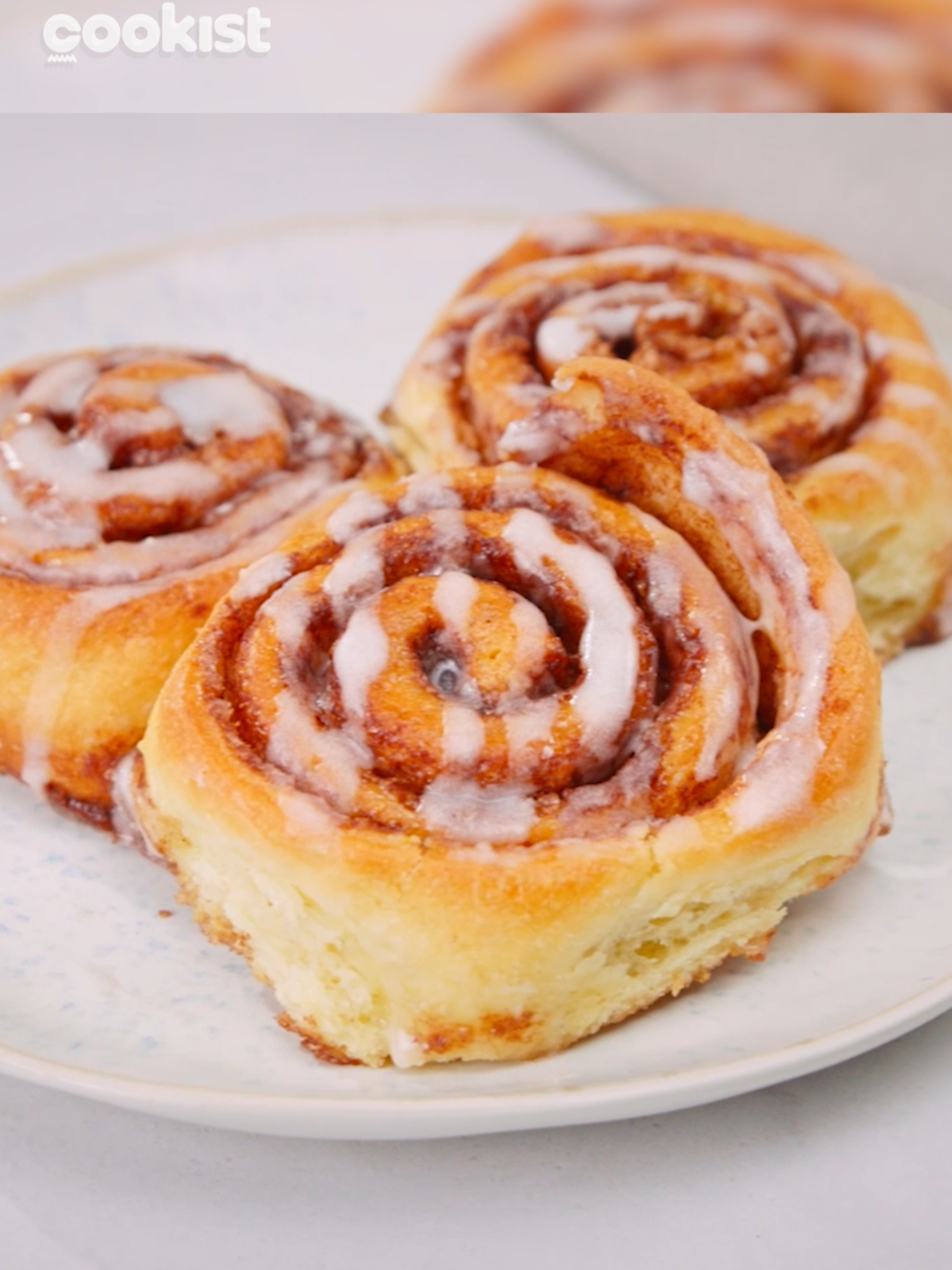 The smell of #cinnamon will fulfill your house 🤤 Super fluffy and ready in a few easy steps 😍 Here's how to make soft and irresistible CINNAMON ROLLS: 👉INGREDIENTS 📌For the dough: 500g (4 cups) all-purpose flour 8g dry yeast 1 egg 260ml (1 cup) milk 50g (1/4 cup) sugar 1/3 tsp salt 70g softened butter 📌For the filling: 120g (1/2 cup) sugar 90g butter 4 tsp ground cinnamon 📌For the glaze: 100g powdered sugar 2 egg whites 5 tsp lemon juice 👉METHOD 1. First, prepare the dough: Pour the milk into a bowl and add the sugar, dry yeast, and mix to dissolve the ingredients. 2. Add the softened butter and egg and continue mixing with a whisk. 3. Now, add the dry ingredients and salt. Work with your hands to obtain a smooth and compact dough. 4. Let it rise for 2 hours or until it doubles in size. 5. In the meantime, you can prepare the filling: Mix the sugar, ground cinnamon, and butter in a bowl. You should get a homogeneous mixture. 6. Now for the glaze: Mix the powdered sugar with the egg whites and lemon juice. You should get a smooth but not too liquid mixture. 7. Once the dough has risen, roll it out with a rolling pin into a rectangular shape. 8. Spread the filling over the entire surface and then roll it up gently. Use a string to cut the roll into slices. 9. Place them in a buttered high-edged baking dish and cover them with a cloth to let them rise for about 40 minutes. 10. Brush the rolls with milk and then bake at 180°C for 30 minutes. 11. Pour the glaze over the cinnamon rolls and separate them individually. 12. Now they are ready to be enjoyed. Did you like the result? 😍👇 #cookistwow #cinnamonrolls #cookistrecipe #easy #fun #quick #delicious #baking #cooking #foodlover #foodblog #foodtok