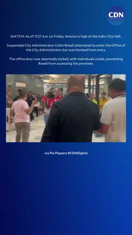 WATCH: As of 11:27 a.m. on Friday, tension continues to rise at Cebu City Hall. Suspended City Administrator Collin Rosell tried to enter the Office of the City Administrator but was blocked. The door was reportedly locked, with individuals inside preventing him from accessing the office. This comes as supporters of dismissed Cebu City Mayor Mike Rama gathered at the Cebu City Hall on Friday morning, November 8, calling for his reinstatement. | via Pia Piquero #CDNDigital