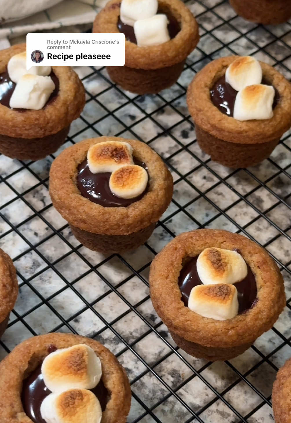 Replying to @Mckayla Criscione  Full recipe for my Mini S’mores Cups below! Ingredients: •3/4 cup unsalted butter, melted •1 cup brown sugar, packed •1/4 cup granulated sugar •1 egg + 1 egg yolk, room temperature •1 Tbsp vanilla extract •1 3/4 cup all-purpose flour •3/4 tsp baking soda •3/4 tsp salt •1/2 a batch of my homemade Chocolate Ganache •48 mini marshmallows *This recipe makes 24 mini s’mores cups. Preheat oven to 350°F and spray a mini muffin pan with nonstick cooking spray. Make 1/2 a batch of my homemade Chocolate Ganache while you’re waiting for the oven to preheat. (ganache recipe is posted) This will give the ganache time to thicken a little before filling cookie cups later. In a large mixing bowl combine cooled melted butter, brown sugar, and white sugar. Stir until combined. Add in the egg, egg yolk, and vanilla extract. Mix until fully incorporated. Add the flour, baking soda, and salt. Stir until fully combined and no streaks of flour remain.  Scoop 1 tablespoon sized cookie dough balls and roll in between yours hands. Place dough balls in prepared muffin tin. Bake for 8-10 minutes or until edges turn golden.  Remove cookie cups from oven and press the centers down while they’re still soft to make a pocket for the ganache. Let the cookie cups cool completely before filling with homemade Chocolate Ganache. Fill the cups with about 1-2 tsp of ganache. Set your oven to a low broil. Top off each ganache filled cookie cup with 2 mini marshmallows. Now place the cookie cups back into the oven for about a minute to slightly brown and soften the marshmallows. Watch very closely or marshmallows will burn! Enjoy🤎 #smores #smorescookies #smorescups #smoresrecipe #bakingtok #chocolateganache 