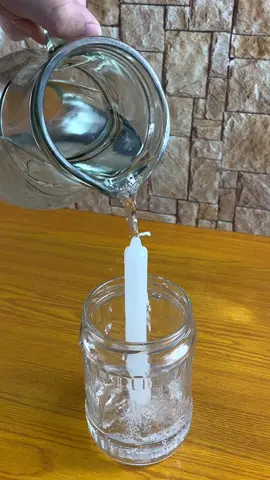Place a candle in a glass container, pour water over it and it will never go out again! #viralvideo #homemade #tips #tipsandtricks 
