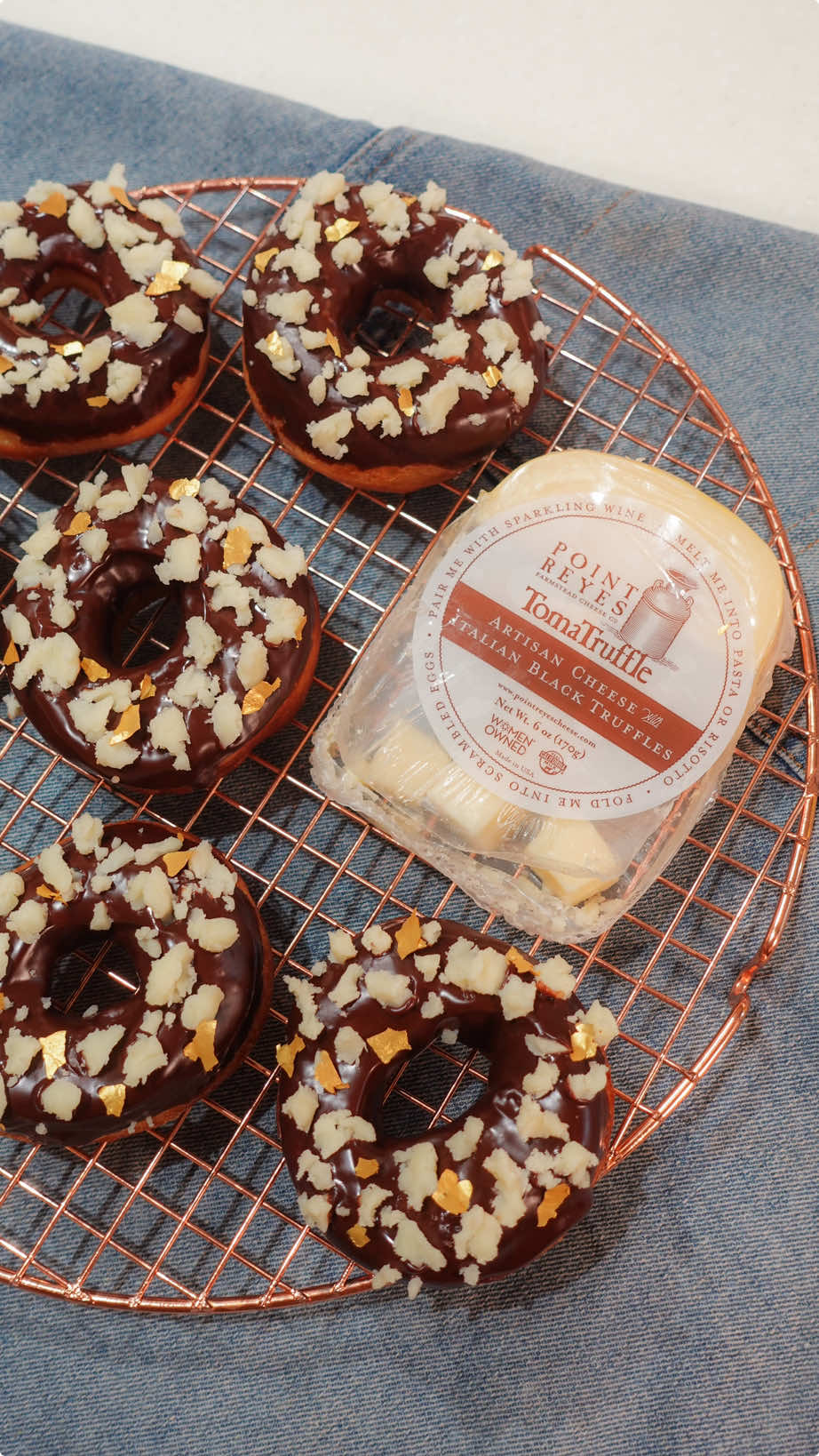 Chocolate & cheese…. In a doughnut??? 😱 YESSS!!! 🧀 also feeling extra fancy so we used @realcaliforniamilk truffle cheese for this, too! ❤️ I’m sure I’m not the only one who’ll love this one 🤭 see recipe and procedure below: Truffle Cheese Crumble Doughnuts by AJ Francisco Yield: Serves 12-15 Ingredients: 390 grams	 Bread Flour 50 grams White Sugar 1 teaspoon Sea Salt 11 grams Instant Yeast 250 grams Milk 1 piece Whole Egg 75 grams Butter 200 grams Whipping Cream 200 grams Dark Chocolate Point Reyes Toma Truffle cheese Procedure: 1. In a mixing bowl, combine together bread flour, white sugar, instant yeast, and sea salt. Lightly mix with a dough hook. 2. Add in California Sunshine milk and egg. Then add butter. Mix for 15 minutes on a medium speed until dough is soft and stretchy. 3. Cover the bowl with a kitchen towel and set aside for 1 hour to let it rise. 4. After so, bring dough to work station and flatten to 1.5-2” thick. 5. Using a doughnut cutter, press on the dough to cute. Grab doughnut shaped dough and transfer to a tray with parchment paper. Repeat until all dough are used. 6. Cover tray with a kitchen towel and proof for 30 minutes. 7. Heat up pot with corn oil to medium heat. 8. Carefully transfer doughnuts one by one to pan and fry each side for 2-3 minutes or until golden brown. Repeat for all. 9. Transfer to a strainer to drip out excess oil and carefully line up in a cooling rack. Set aside. 10. In a small bowl, combine warm whipping cream and dark chocolate. Mix until smooth. 11. Dip doughnut in chocolate ganache and place back in cooling rack. Repeat for all. 12. Add crumbled Point Reyes Toma Truffle cheese as toppings. 13. Serve and enjoy! #bake #baker #baking #bakersoftiktok #bakingrecipe #Recipe #baketok #chocolate #cheese #truffle #doughnut #minivlog #adayinmylife #pov #cashier #cashierserye #dessert #desserts #pastry #pastrylife #food #Foodie #foodieph #recipesoftiktok #learn #LearnOnTikTok #RealCaliforniaMilk #RealCaliforniaCheese #pinoychefs #chefsandcheese #fy #fyp #foryou #foryoupage 