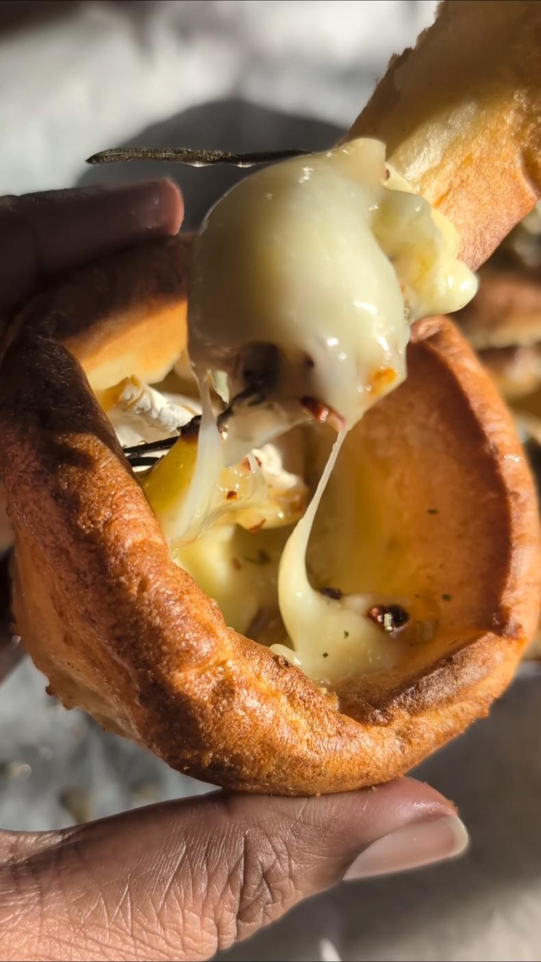 CAMEMBERT YORKSHIRE PUDDINGS 🧀🎄 Here's an idea for you - Yorkshire puddings stuffed with camembert, honey, spices and rosemary and baked to gooey cheesy perfection. Individual portions for your family and friends this Christmas 🥰 It's pretty simple, slice some camembert and stuff in some prey made Yorkshire puddings. Add some honey, rosemary and spices or chutneys of your choice. Bake in the oven along with a few extra plain Yorkshire puddings. Cook in the oven at 185°C to your liking! You want the cheese to be melted and the Yorkshire puddings slightly crispy. Slice the plain Yorkshire puddings to dip into the camembert. 🤤 SO GOOD! 💛🎄 #christmasideas #christmas #camembert #yorkshirepudding #yorkshirepuddings #christmasrecipes #christmasfood #cheese #foodhacks #fyp #fy 