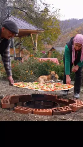 They're making Giant meatball pizza. Arustic delicacy baked underground #pizza #meatballs #cheese #buggers #kazhakstan #uzbekistan #tajikistan #ukrainefood #ukrainianfood #rusia #rusianfood #giantpizza #unitedstates 