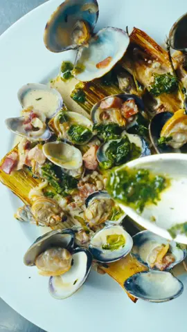 Leeks and Clams - Another Day In Paradise  Working on new supper club menus, and couldn’t help but shoot this one. Leeks  Dry white wine  Cream  Mint Coriander  Parsley Garlic  Capers + brine  Vinegar Evoo  Lardons Garlic Shallot Fresh thyme Evoo  Dry white wine Burnt onion cream  Lemon Salt 