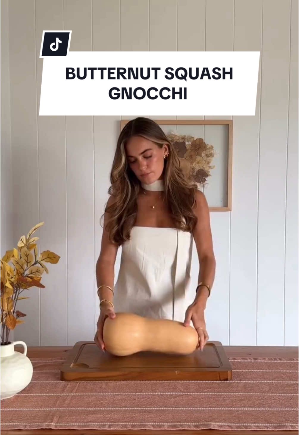 Butternut Squash Gnocchi 🧡👩‍🍳 @audrey lillian walks us through how to prepare the perfect fall pasta while wearing the LPA Esfira Top ✨ See the recipe details below👇 Ingredients Puree: · 1/2 butternut squash peeled and diced · 1 small yellow onion · 1 garlic bulb · olive oil · salt · pepper · 12oz Italian sausage · 16oz gnocchi · 2 garlic cloves minced · 3/4 cup chicken stock · 1 cup heavy cream · 1/2 tbsp fresh sage · 1/2 tbsp fresh thyme · black pepper to taste · salt to taste Toppings: · sage · thyme · parmesan Instructions: 1. Preheat oven to 425F. Peel and dice your butternut squash. Save the other half for later. Roughly chop your onion and cut the top off your garlic bulb. Add squash, onion and garlic into a baking dish and drizzle over olive oil. Season with salt and pepper, mix well, then bake for 30 minutes in the oven until squash is soft. 2. Add your roasted squash, onion, and squeezed garlic bulb into a food processor or blender. Blend until smooth and set aside. 3. In a large skillet heat some olive oil on medium high heat. Add your chopped sausage and cook for 5 minutes until browned and cooked through. Add your gnocchi and garlic, frying for another minute. 4. Pour in your chicken stock and heavy cream. Mix well then bring to a boil, cover and simmer on medium heat for 5 minutes. 5. Uncover your gnocchi and mix. Add in about 1 1/2 cups of your puree and save the rest for later. Mix well then finish it off with pepper, sage and thyme. Serve and top with more sage, thyme and freshly grated Parmesan. Enjoy!!! #revolve #fallrecipe #recipes #butternutsquash #gnocchi #pasta #DinnerIdeas #easyecipes #cooking #inthekitchen #fallcooking 