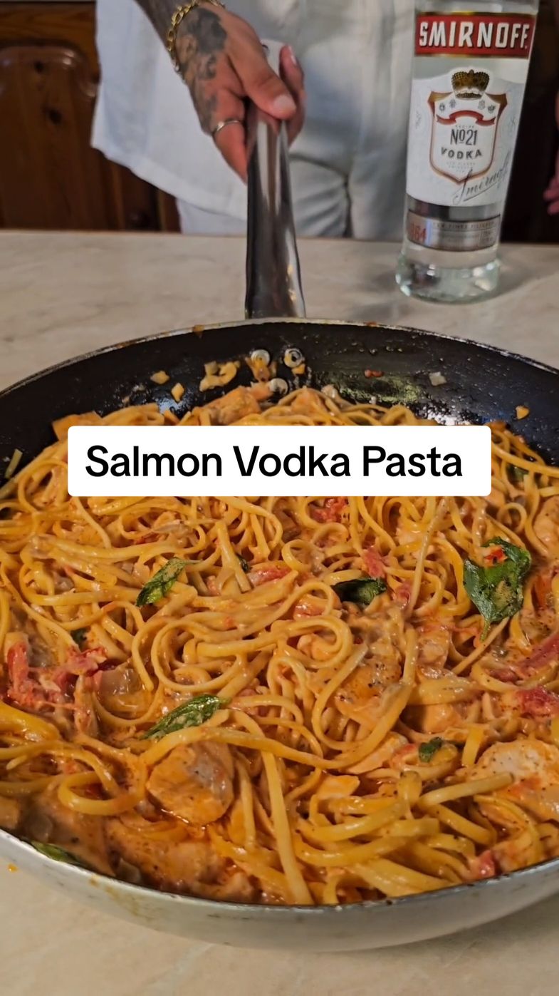 Salmon Vodka Pasta 🍝👌 (Save for later😘) I was sweating buckets but the dish came out perfect😍 Will you try it out? Let me know in the comments👇 Ingredients: 2 fillets of Salmon (500g) 1 tablespoon Olive Oil 2 tbs unsalted Butter 1 finely diced Onion  2 cloves Garlic 1tsp Salt 1 Red Chilli 400g Peeled Tomatoes  150ml Smirnoff Vodka 300g Bucatini Pasta 200ml Heavy Cream 100g Parmesan Cheese 1 fresh Basil Leaves  #vodkapasta #smirnoffvodka #salmonpasta #salmonvodkapasta #vodkarecipe #salmonrecipe #pastarecipe 