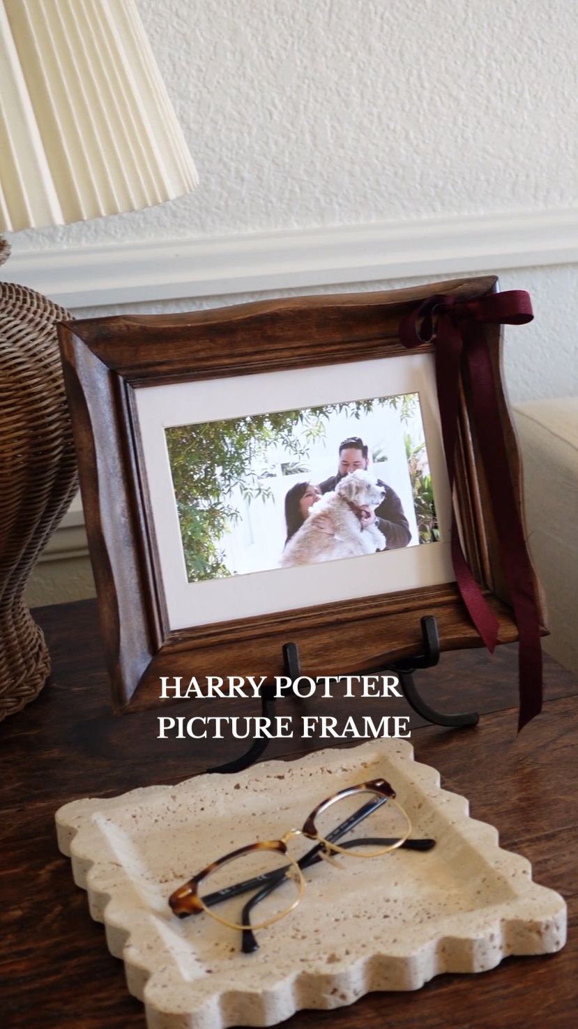 Harry Potter's Moving Picture DIY [The magic of upcycling 🪄✨️] At one point or another, we bought, or we were gifted a digital picture frame. We loved it until we didn't 🫠 maybe you didn't even open the box lol Try this out before you toss it. It will 99% change your mind on it. When I saw this at the thrift store (and basically brand new), I indeed thought of Harry Potter 🧙‍♂️ and I wanted to recreate my own moving picture. Recreating the moving picture is quite easy. Just set up your camera on video mode, pretend to take a picture, and voilà 📸✨️ upload it to the digital picture frame. For the frame, you have two options, either make it from scratch or find a frame that may already fit. In my case, I found a frame that was so close in size that I could trim some of the excess off.  What do we think? Whose going to give it a try? #digitalframe #pictureframe  #thriftflip #homedecor #diyholiday  #diyprojects  #harrypotter #christmasgiftsideas #diygift #diychristmas 