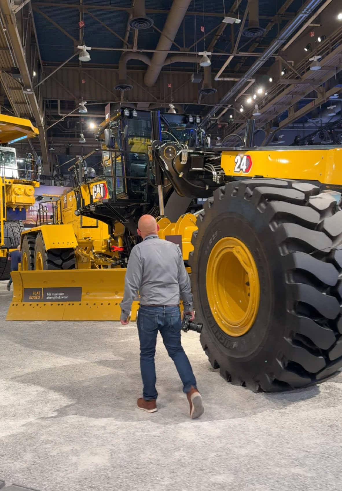 Cat 24 grader on display at MINExpo 2024. The 75 tonne machine is equiped with a 24ft moldboard, hence the 24 model number and is powered by a 535hp diesel engine.  #grader #mining #construction #heavyequipment #cat24grader #minexpo2024 