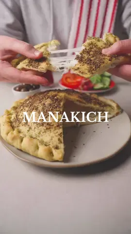 Manakish #zaatar and #cheese: a taste of# Lebanon’s unity, uniting flavors and hearts 🫓 Dough recipe : 4 cups flour  1 tbsp yeast  1 tbsp sugar 1/2 tbsp salt  1/4 cup of oil  1 to 2 cups of warm water or until you get a perfect dough texture  Mix all together  Leave the dough to rise for atleast 1 hr  For the filling : Aakawi &  Mozzarella cheese  For the external layer :  Zaatar & olive oil   Bake for 15 min or until done and enjoy with tea , olives and veggies #tiktokcookbook #toomacooks  