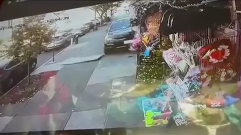 Surveillance video shows a car fly down a sidewalk in Brooklyn narrowly missing pedestrians after the driver suffered a medical episode. It happened at 12:55 p.m. at East 35th Street and Church Avenue in East Flatbush on Monday. Police said a 38-year-old man driving a Jeep barreled down the sidewalk, sheared the entrance of a discount store and smashed through its display items and continued past a furniture store where the owner heard the vehicle coming. 