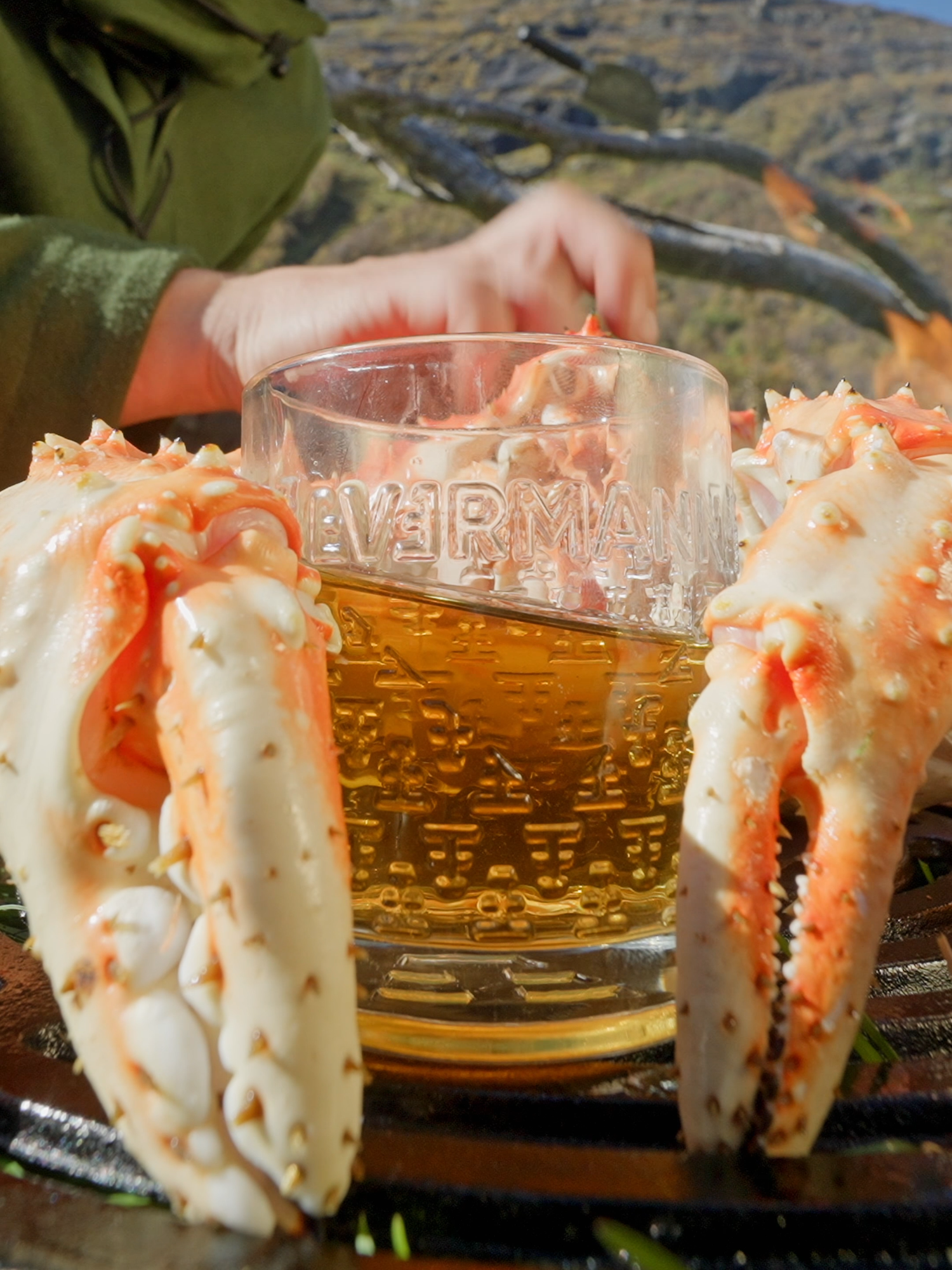 Whole king crab, kissed with chili butter and a touch of golden elixir 🔥🦀🥃  #firekitchen #asmr #outdoorcooking #kingcrab #bushcraft