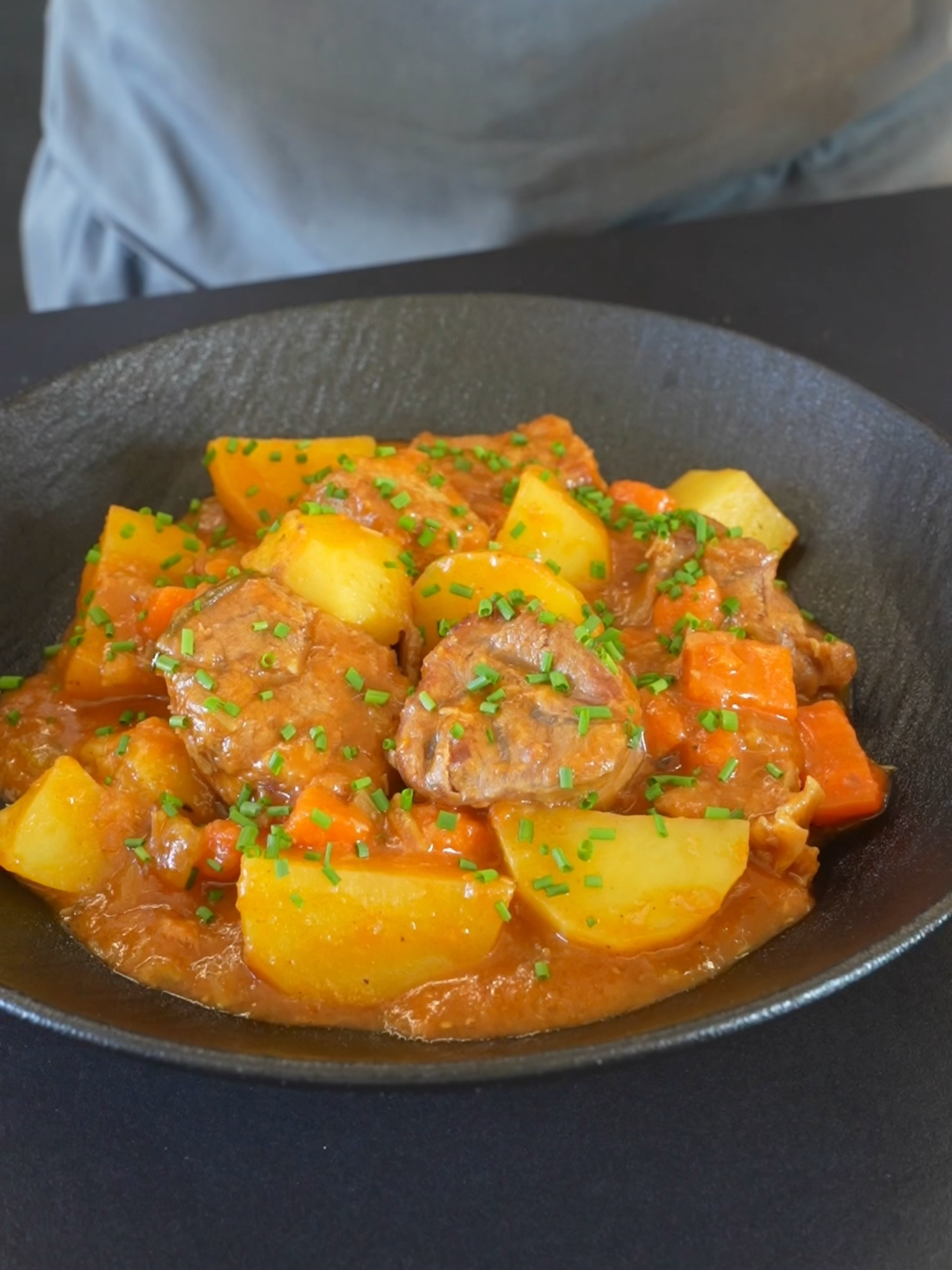 🥔🍖 Warm up with an Italian Veal Stew with Potatoes! Perfect for cozy evenings🔥 Ingredients 4 ½ lbs veal shoulder, cut into large cubes (2 kg) 3 celery stalks, diced 2 carrots, diced 1 onion, diced Flour, for dredging the meat 1 tablespoon butter Olive oil, as needed 1 tablespoon tomato paste 1 sprig of rosemary Broth, enough to cover the ingredients Salt and pepper, to taste 2 potatoes, cut into large chunks 2 bay leaves Fresh chives, chopped, for garnish Instructions Lightly coat the veal cubes with flour, shaking off any excess. In a large pot, heat the butter and a drizzle of olive oil over medium-high heat. Sear the floured veal cubes for about 10 minutes until golden on all sides. Remove the meat from the pot and set aside. In the same pot, add the celery, carrots, and onion. Sauté for about 5 minutes, stirring occasionally. Stir in the tomato paste and rosemary, mixing well to combine the flavors. Pour in enough broth to cover the ingredients, and add salt and pepper to taste. Return the veal to the pot. Cover and simmer on low heat until the meat is nearly tender. Add the potato chunks and bay leaves. Continue cooking until both the meat and potatoes are soft. Serve the stew hot, garnished with chopped chives.