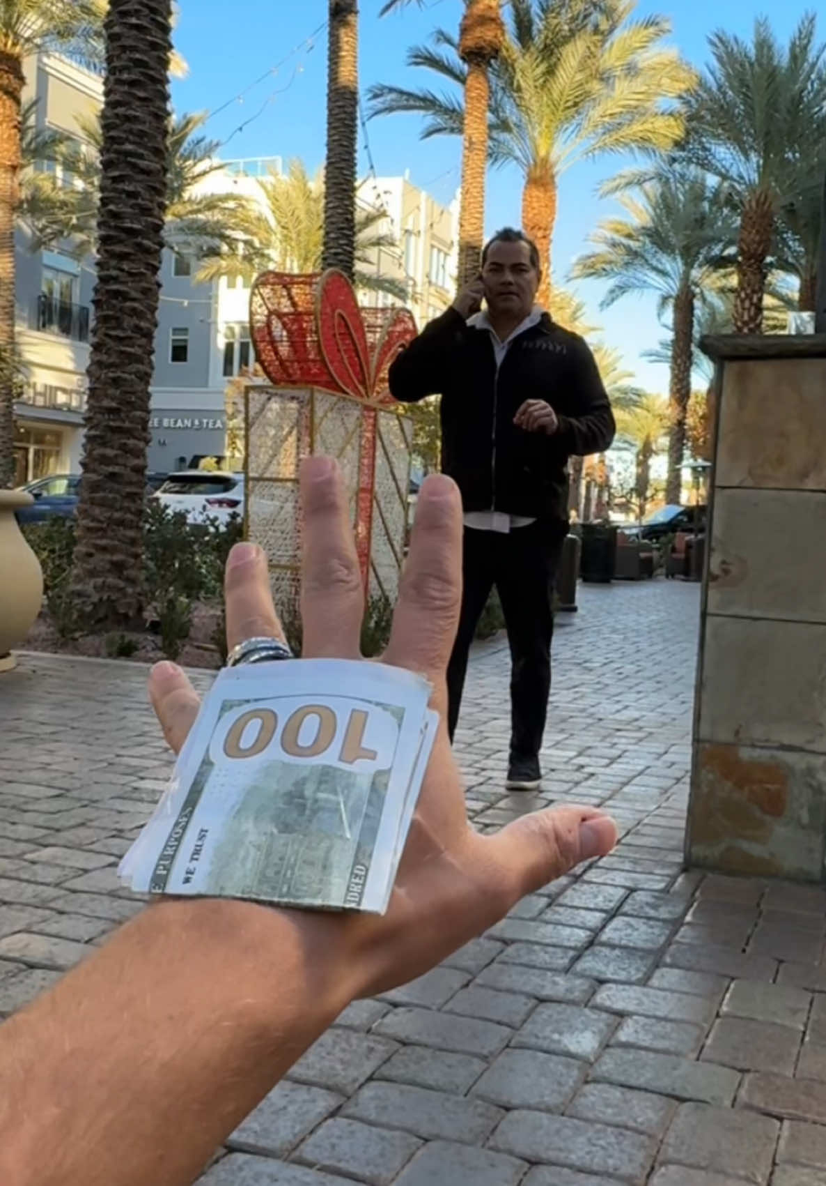 Guy falls down and asks for help and gives kind people gifts 