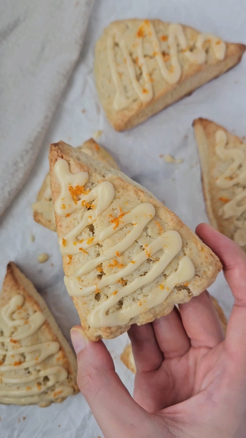These Orange Cardamom Scones are drizzled with a simple orange glaze and flavored with cardamom extract, fresh orange juice and zest! These cozy scones are the perfect combination of warm spice and bright citrus. 🍊 I was so excited to try out the @burlapandbarrel Cardamom Extract from the @fikabrodbox 5th Anniversary Fika Box! I loved it so much that I put it in both the dough and the glaze for these scones. 😊 #fikabrödbox #fikabröd #baking #scones #orange #cardamom #orangecardamom 