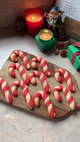 Candy cane cookies 🎁✨ Find recipe via the link in my bio 🎄 Ingredients: 225g unsalted butter (room temp.) 115g granulated sugar 10g vanilla sugar (optional) 65g powdered sugar 1 egg 400g all-purpose flour 1 tsp salt Red food coloring Instructions: Mix together the butter, granulated sugar, vanilla sugar and powdered sugar Add the egg Stir in the flour and salt Divide dough in two and combine the red food coloring with one half Refrigerate for 1 hour Preheat oven to 180°C Measure 15g of each color dough and gently roll into 10 cm long log shapes Twist cookie dough together and transfer to a baking sheet lined with parchment paper Bake at 180°C for 11 min Let the candy cane cookies sit on the baking sheet for 5 minutes before transferring them to a wire rack to cool completely #candycane #christmas #christmasbaking #christmasrecipe #christmascountdown #christmascookies #baking #Recipe #EasyRecipe 