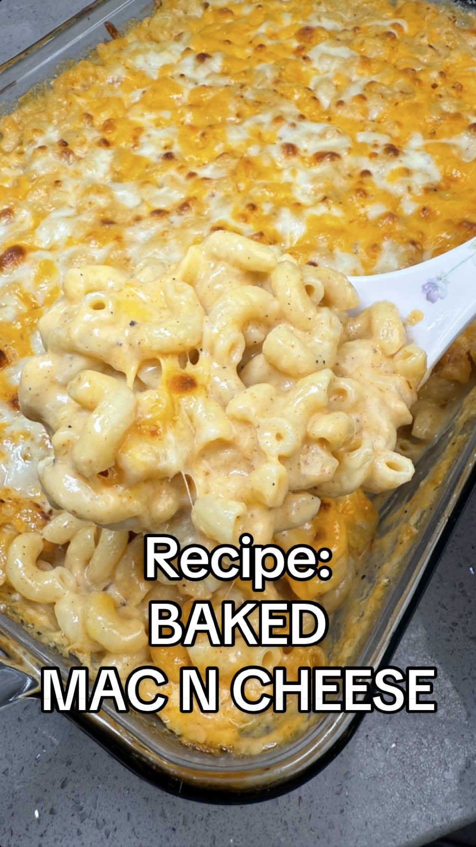 Can’t believe we’re fighting over Mac & Cheese… to each their own.  Just be nice in the comments.😅 ➡️ Recipe: Baked Mac & Cheese  * 1 lb elbow macaroni  * 3 tbsp butter  * 3 tbsp flour  * 1 cup heavy cream, warmed  * 2 cups whole milk, warmed  * 2 1/2 cups sharp cheddar, shredded, save 1/2 cup for topping * 1 1/2 cups fontina cheese, shredded, save 1/2 cup for topping * 1 1/2 cups mozzarella cheese, shredded, save 1/2 cup for topping  * 1/2 cup parmesan cheese, grated * 1/2 cup pasta water  Seasonings— * 1 1/2 tsp seasoned salt  * 1 tsp dijon mustard * 1 tsp garlic powder  * 1 tsp onion powder  * 1 tsp smoked paprika  * 1/2 tsp cayenne powder  * 1/2 tsp black pepper  * 1/8 tsp nutmeg 1. Freshly shred all of the cheese. Set 1/2 cup of cheddar, fontina, and mozzarella aside for topping.  2. In a large pot, boil enough water to cook macaroni. Salt the water with 2-3 tbsp of salt. Bring to a boil and cook macaroni 3 mins less than instructions suggest. Reserve 1/2 cup of pasta water from the pot then strain the macaroni. Drizzle oil over the noodles and toss well so it doesn’t stick together. 3. Preheat oven to 375F. 4. Warm heavy cream and milk in the microwave for 30 secs-1 min and set aside. This helps with not breaking up the roux. 5. In a large pan and on medium-low heat, melt 3 tbsp of butter and add 1 tbsp of flour at a time (totaling 3 tbsp) to the butter and whisk until combined. Stir until roux turns lightly golden. About 2 mins.  6. On medium-low heat, slowly stream warm heavy cream and milk into the roux, while whisking continuously.  7. Once both the heavy cream and milk are combined and there are no more clumps, turn the heat off and add in a hand full of cheese at a time while whisking continuously to melt the cheese. Do this until all the cheese is incorporated and melted. Sauce should thicken and become smooth and cheesy. (We turn the heat off because if you over cook the cheese the sauce will become gritty)  8. Add all of the seasonings, dijon mustard, reserved pasta water to the sauce and mix well.  9. Add all of the macaroni to the sauce and mix well.  10. Pour it all into a baking dish.  Spread evenly and top with remaining cheese. Bake in over for 15 mins at 375F and then broil for 5 mins on high. Remove from oven. Let it cool for 10-15 mins before serving. Enjoy!  #macandcheese #cheese #macncheese #Recipe #EasyRecipe 