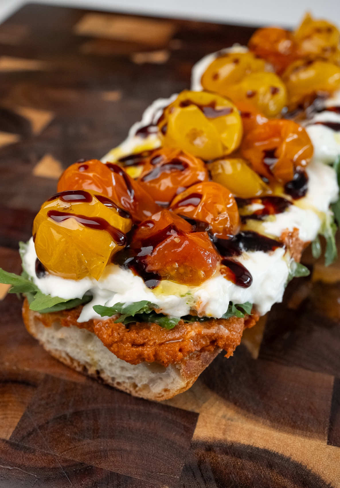 Roasted Red Pepper & Burrata Sandwich with Cherry Tomato Confit This sandwich is everything you could ask for. The smoky muhammara, creamy burrata, peppery arugula, and sweet cherry tomato confit meld perfectly between crisp baguette halves, creating a simple yet deeply satisfying bite. #EasyRecipe #californiaeats #socal #sandwich #baguette #burrata #italianfood #fyppp  Sandwich recipe Burrata sandwich Tomato confit Roasted red pepper