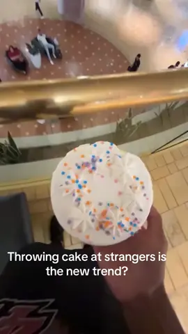 Throwing cake at strangers is the new trend?