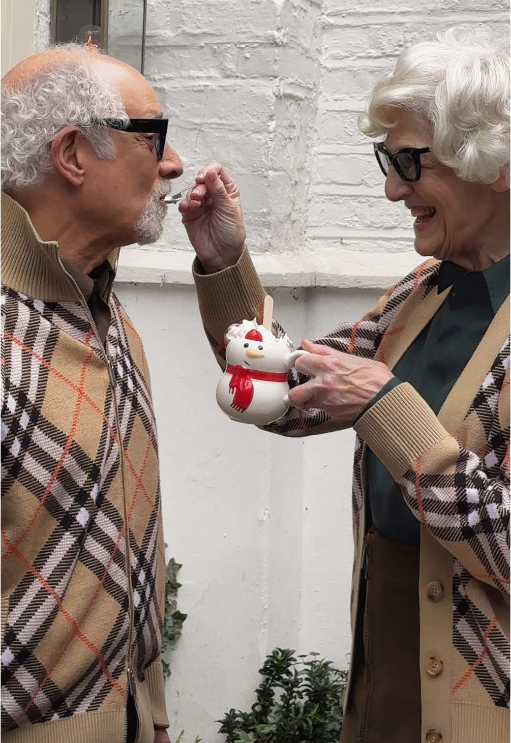 Hot chocolate with long time clients of the house, Drs. Herschel and Lilly Stoller, whose relationship with Burberry has grown over 20 years #WrappedInBurberry 