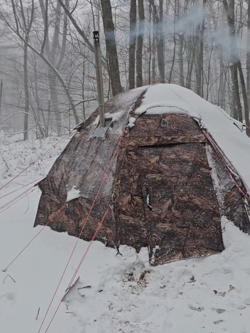 Camping out in the hot tent during a November snow storm #fyp #camping #Outdoors #woodstove #campcooking #hottent #offgrid