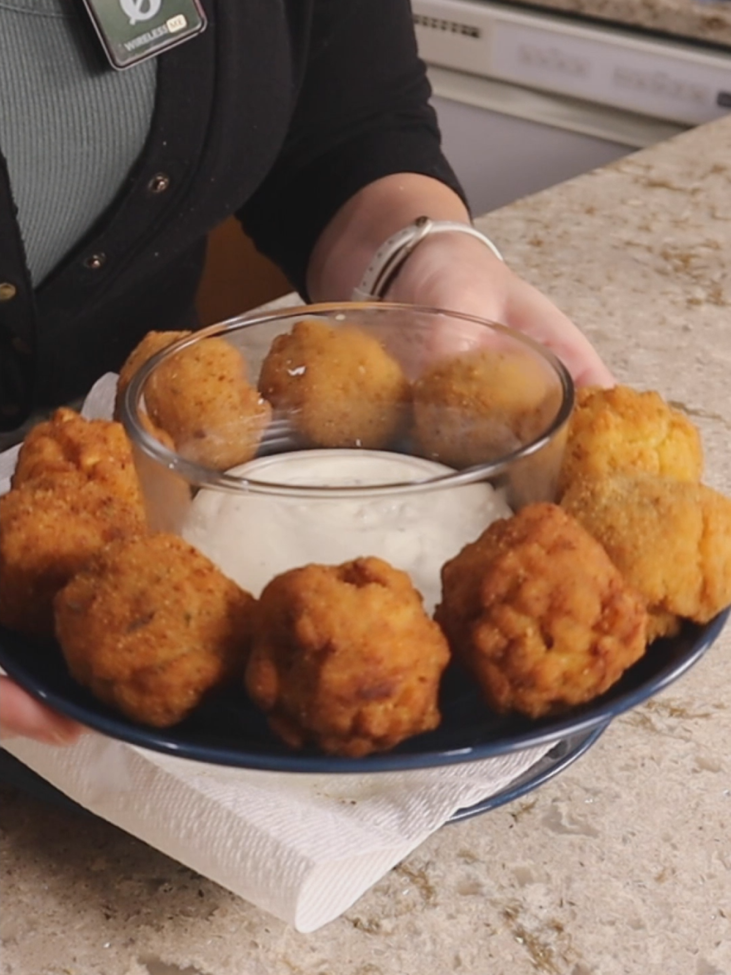 I made a 3-course Thanksgiving dinner on a $20 budget from Dolalr Tree, starting with these crispy and creamy fried mac & Cheese bites.  They're crunchy on the outside, tender and cheesy on the inside and perfect with ranch for dipping.  Stay tuned for the main dish and dessert.  Ingredients: 1 box Kraft Thick & Creamy mac & cheese 1 & 1/2 cups of water 1/2 cup of milk (plus extra for breading) 2 tablespoons of margarine Italian seasoned breadcrumbs Oil for frying Ranch dressing (for dipping) Instructions: 1) In a pot, combien the macaroni, water, milk, margarine and cheese powder from the box. 2) Bring to a boil, stirring occassionally, then cover and simmer for 8 minutes continuing to stir occassionally 3) Transfer to a shallow container and refrigerate for at least 4 hours (preferrably overnight) 4) Remove mac from the container and cut it into 12 cubes 5) Coat each cube in italian breadcrubs, dip in milk, then coat again in breadcrumbs.  Compress the cubes into balls while breading to shape them. 6) Heat 1 inch of oil in a pot and fry the mac and cheese balls in two batchdes for 3 to 4 minutes or until golden brown. Drain on paper towels.  Serve with ranch for dipping. Enjoy!  #budgetfriendlymeals #dollartreefinds #thanksgivingonabudget #thanksgivingdinner #friedmacncheese #budgetcooking #dollartreemeals #3coursemeal #thanksgivingrecipes #holidaycooking #easyappetizers #budgetthanksgiving #tiktokfoodie