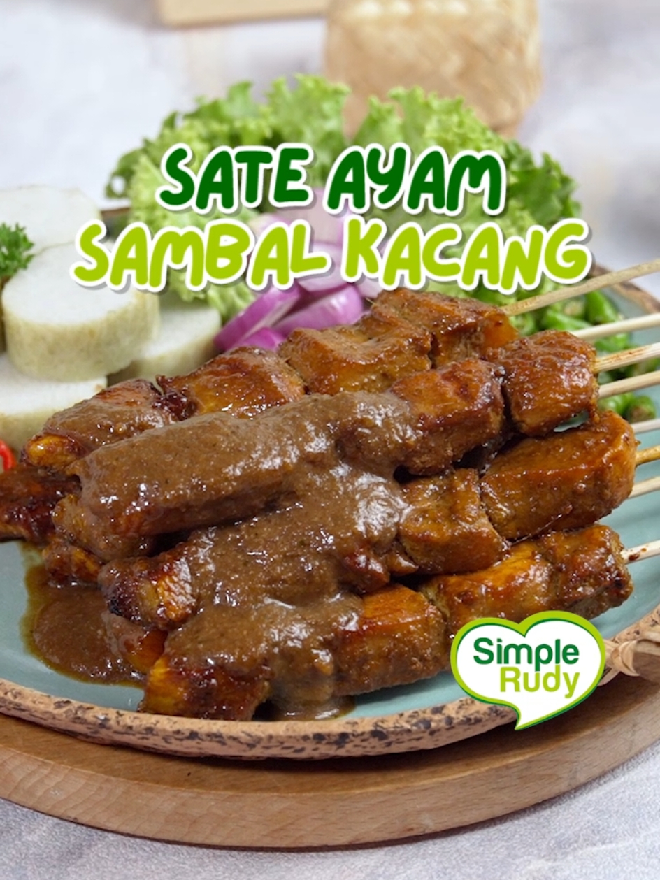 Makanan satu ini tuh nggak cuma favoritnya anak-anak tapi orang dewasa pun pasti suka yaitu Sate Ayam Sambal Kacang. Ayam yang berempah klop banget dimakan sama sambal kacang yang legit 🥰 🍗SATE AYAM SAMBAL KACANG🍗 Resep Rudy Choirudin Bahan 1: - 600 gram Daging Ayam, dipotong dadu untuk sate  - 1 saset Bumbu Desaku Marinasi - 2 sendok makan Air Bahan 2 (dihaluskan): - 100 gram Kacang Tanah Goreng - 1 saset Desaku Bawang Putih Bubuk - 1 sendok teh Ladaku Merica Bubuk - 2 sendok makan Bawang Goreng - 3 lembar Daun Jeruk - 50 gram Gula Merah Serut - 1 sendok makan Gula pasir - 1 sendok teh Garam - 400 ml Air Bahan 3: - 4 sendok makan Kecap Manis - 1 sendok makan Air PELENGKAP - 10 buah Bawang Merah, dirajang - 10 buah Cabe Rawit Hijau, dirajang  - 2 sendok makan Bawang Goreng - Tusuk sate sesuai kebutuhan  - Lontong atau nasi sesuai kebutuhan  CARA MEMASAK : 1. Campur semua bahan 1 (daging ayam, Bumbu Desaku Marianasi, dan air), aduk rata. Kemudian tusuk dengan tusuk sate, diamkan 30 menit. 2. Bumbu Kacang : haluskan bahan 2 (kacang tanah goreng, Desaku Bawang Putih Bubuk, Ladaku Merica Bubuk, bawang goreng, daun jeruk, gula merah serut, gula pasir, garam, dan air) , kemudian masak dengan api kecil hingga berminyak dan mengental. Masukkan 2 sendok makan kecap manis ke dalam bumbu sate, aduk rata. 3. Bumbu Olesan : campur 1 sendok makan bumbu kacang, 2 sendok makan kecap manis, dan 1 sendok makan air, aduk rata. 4. Bakar sate hingga berubah warna, lumuri dengan bumbu olesan sampai rata, bakar kembali sampai matang. 5. Siapkan piring saji, beri bumbu kacang, cabe rawit, bawang merah, sate dan lontong. 6. Hidangkan.  #simplerudy #resepsimple #sateayam #sateayampraktis #sateayamsambalkacang #sateayambumbukacang #idemasakan #fyp #viral #trending