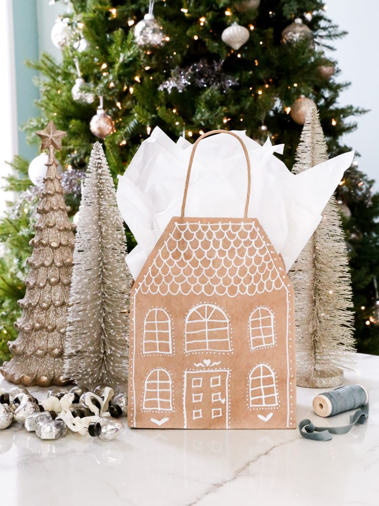 GO to my Profile + tap 🔗 + type “DIY Gingerbread House Gift Bag” into the search bar for all of the details.