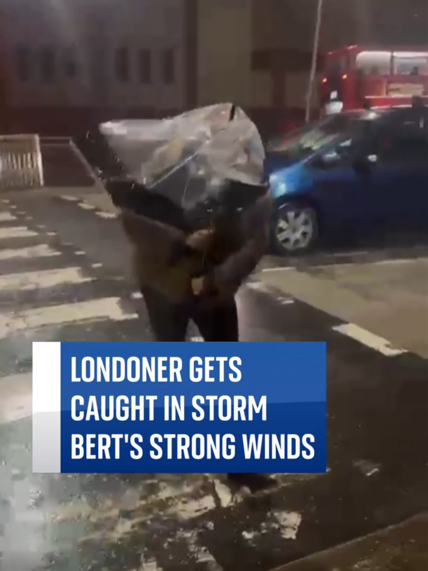 A woman in East London lost her umbrella in Storm Bert's strong gusts as the Met Office issued a new yellow weather warning for wind #stormbert #weather #ukweather