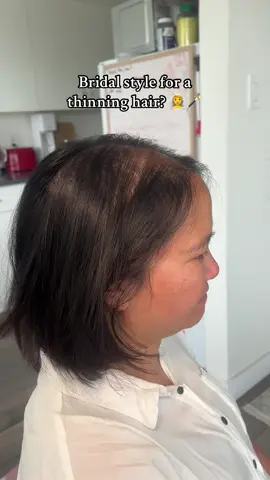 Say goodbye to thinning hair worries on your big day!Here's how I seamlessly secure a hair topper for a flawless bridal look: Anchor Points: I use secure, discreet clips that lock into place without pulling or damaging your natural hair. I use a volumizing powder for a secure grip. Color Match Magic: I pull a natural hair underneath to blend with the artificial hair. A perfectly matched topper blends effortlessly for a natural, voluminous look. Light as Air: Styled and set to move with you, so you can dance the night away worry-free! The result? A stunning hairstyle with confidence built right in. Every bride deserves to feel her absolute best —thinning hair included! #weddinghair #thinnhairsolutions #thinninghairsolution #bridalhair #vancouvermakeupartist #bridalmakeupartist #makeupartistvancouver