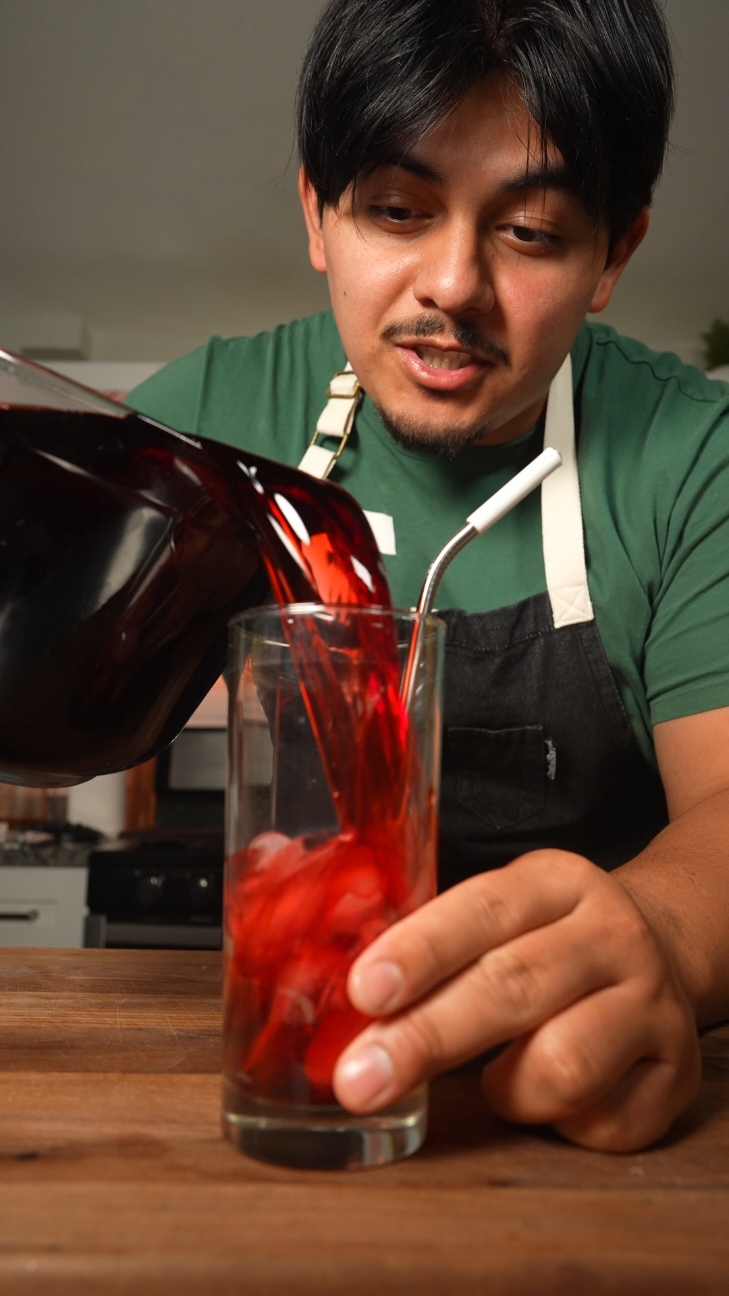 Agua de Jamaica, and gummy bear in a drink is the best way I can describe it! This agua Fresca goes with anything, NOT just Mexican Food! #aguafresca #aguadejamaica  #drink Here is the recipe so you aren't wandering for it!  10C water 1Cup sugar 1Cup flor de Jamaica 