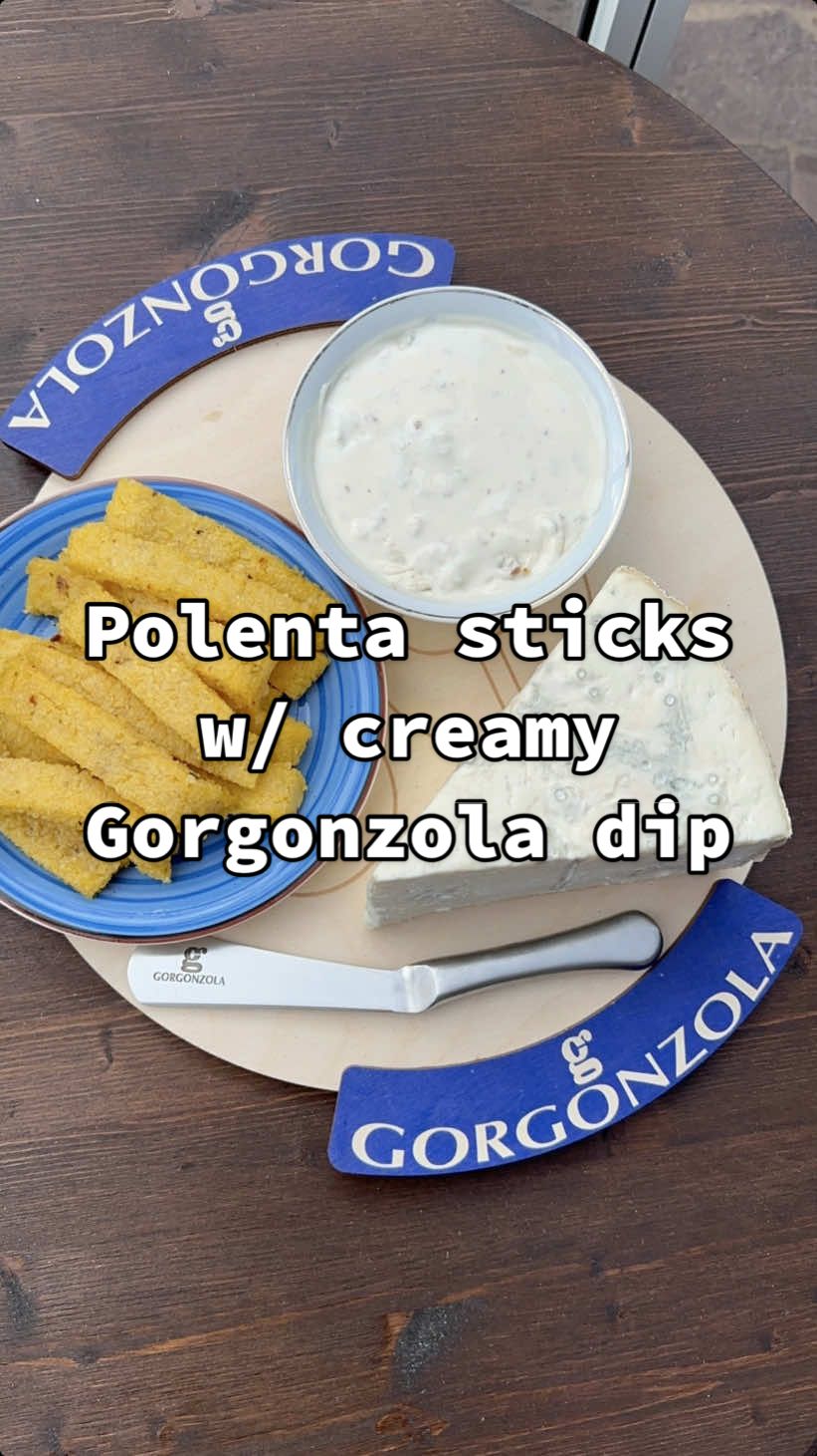 Polenta sticks with a creamy Gorgonzola dip! 🍟 @Gorgonzola Dop asked me to make a recipe - and since I was back in my hometown I decided to make something inspired by it: polenta (sticks) Ingredients: 150g polenta flour 600g water 1tbsp salt 1tsp oregano and chili flakes 200g Gorgonzola PDO 80ml cooking cream 1tbsp chopped walnuts A few tsp olive oil Procedure: Bring the water to a lukewarm point and dissolve in the salt. Add the polenta flour, oregano and chili flakes and stir - if using precooked it’ll take 10 minutes, otherwise up to 40 minutes to fully cook. Transfer to a casserole dish lined with parchment paper and spread 1 or 2cm thick with a wooden spoon. Let it cool down fully and cut into strips 1.5cm wide and thick. Place on an oven tray, sprinkle with olive oil and salt and bake for 20 minutes at 200°C. To make the dip start by heating up the cream on medium-low heat in a small pot. Cut the Gorgonzola PDO into chunks and add them to the pot. Stir for 5 minutes and once melted add the walnuts and optionally a pinch of salt (taste for seasoning). Let it cool down in the fridge for 20 minutes and dish up! Buon appetito 🙂‍↔️ #EndlessTaste #GorgonzolaDop #ConsorzioGorgonzolaDop #ADV