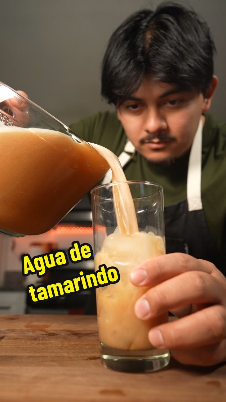 add this to your list of best drinks with TACOS! Agua de tamarindo combines the perfect balance of sweet and sour and is best served iced cold. #aguafresca #tamarindo here's the recipe so you aren't wandering for it!  15 finger sized sweet tamarindo pods 6Cups of water (3 to boil, 3 to finish) 1/2C sugar (1/3 for less sweet)