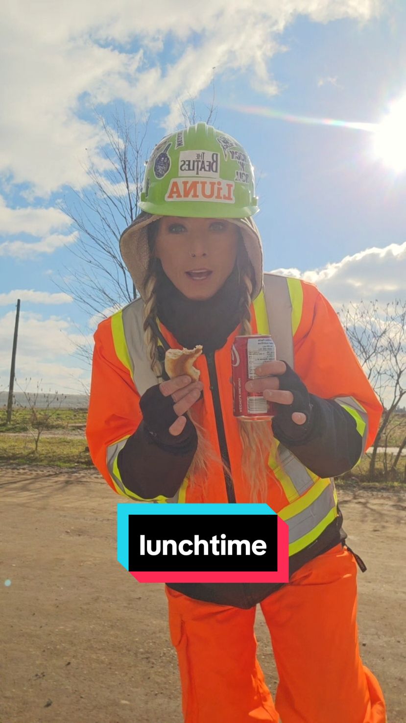 lunch time means eat while you work. normally my flagger is in hand at the same time , I did have to grab it multiple times though ! #girlssupportgirls #construction #roadcrew #flagger #flaggirl #liuna #highvise #fyp #foryoupage #goviral #viraltiktok #lunchtime #workingwomen #over40tiktok 