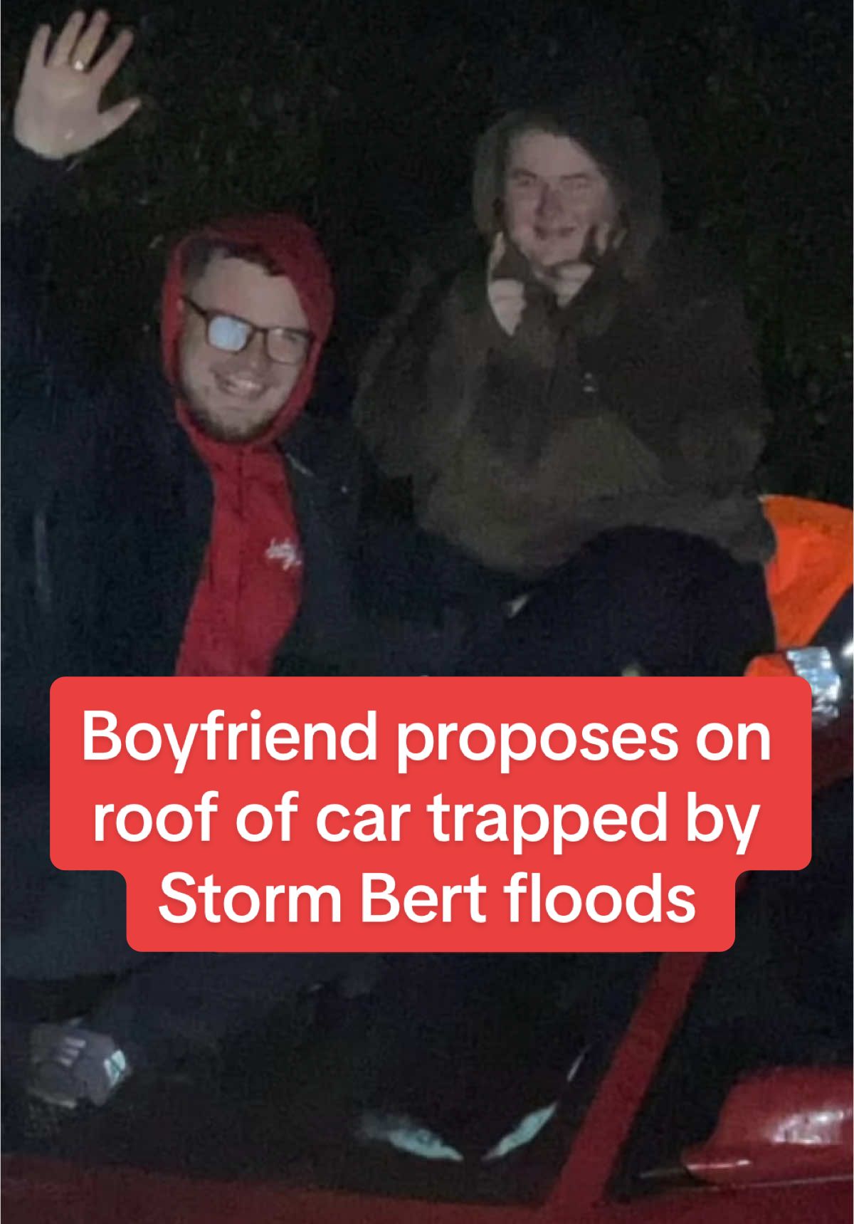 Boyfriend proposes on roof of car trapped by Storm Bert floods #dailymirror #breakingnews #fyp 