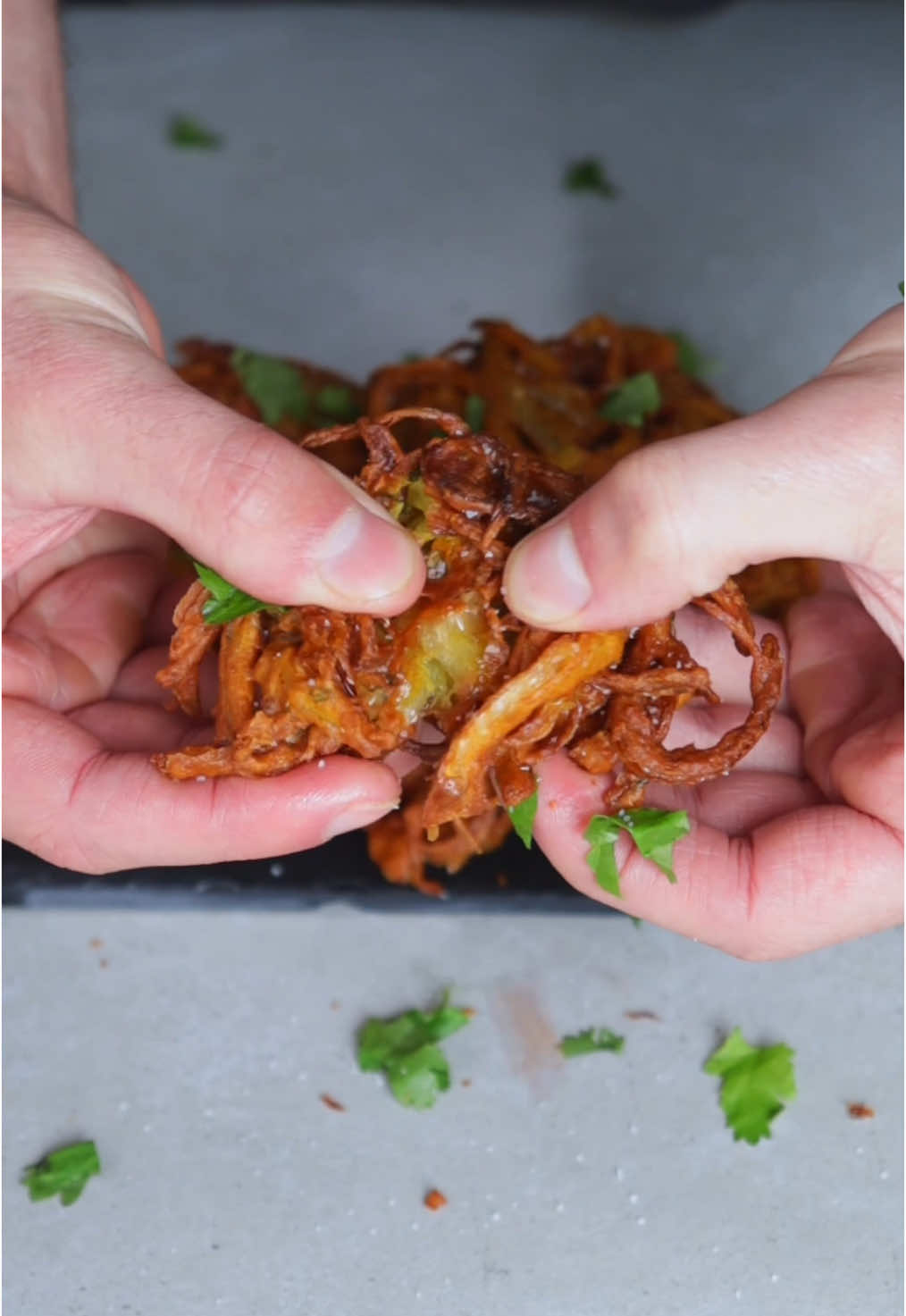 Indian Onion Bhaji 🧅🇮🇳 ⠀ Onions, deep-fried in a fragrantly spiced batter served with a refreshing cilantro yogurt dip 🤤 I don’t often deep-fry, but this was absolutely delicious! ⠀ RECIPE For the Bhaji: - 2 large onions - 1-2 jalapeños - small bunch cilantro - small piece ginger - 1/2 tsp garam masala - 1/2 tsp ground coriander - 1/2 tsp ground cumin - 1/4 tsp ground turmeric - 1/4 tsp red chilli powder - 3/4 cup (100 g) gram flour (chickpea flour) - 1 tsp salt - splash of water, if needed - 2 liters neutral oil for frying - salt, to dust after frying ⠀ For the dip: - 1/4 cup vegan yogurt - Small bunch cilantro - 1 jalapeño - 1 small garlic clove - Small piece ginger - 1/2 lemon, juiced - Pinch of salt ⠀ ❶ Slice the onion lengthwise, then add them to a large bowl and combine with the ingredients for the batter. Set aside. ❷ Blend all ingredients for the yogurt dip. Set aside. ❸ In a medium pot heat the oil to 160°C.  ❹ With slightly wet hands, form small clusters of the onion batter mixture and carefully add them to the hot oil. Fry until deeply golden brown. ❺ Place the bhaji on a paper towel or wire rack, season with salt, then repeat with the remaining batter. ❻ Serve with the yogurt dip and enjoy! ⠀ Please tag me if you make it, I love seeing your remakes! <3 ⠀ Much love, Paul :) ⠀ #EasyRecipes #indianfood #veganfood #tiktokfood 