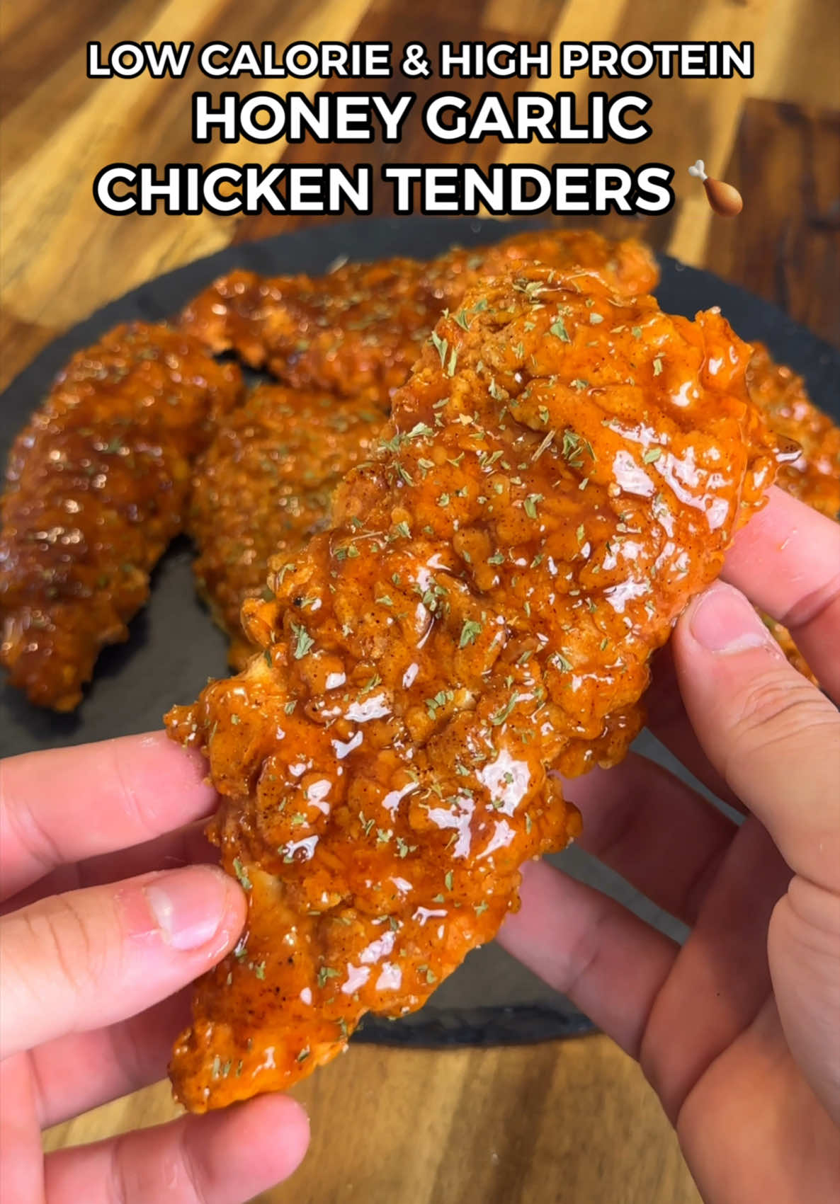 Healthy & Easy Low Calorie Honey Garlic Chicken Tenders! 🍗🔥 (Macros: Per Tender - 8 Total) 239 Calories 18.5gC | 3.5gF | 31gP Don’t forget to check out my digital recipe cook books with over 200 easy & delicious recipes like these! 📖👨🏻‍🍳 Ingredients: 700g Boneless & Skinless Chicken Breast (raw weight - butterfly & slice into 8 thin strips) 1 Tsp Salt, 1.5 Tsp Smoked Paprika, 1 Tsp Garlic Powder, 1/2 Tsp Cayenne Pepper 200g Plain All Purpose Flour (not all of this gets used - approximately 10g - 15g sticks to each tender) 100g Potato Starch (not all of this gets used - approximately 5g - 8g sticks to each tender)  Season Flour With Same Seasonings Above 1 Cup Sparkling Water/Soda Water Honey Garlic Sauce: 4 Minced Garlic Cloves 80ml Low Sodium Soy Sauce 80ml Water 10g Minced Ginger 40g Honey 1 Tsp Potato Starch Mixed With Water Parsley Flakes (optional) #friedchicken #chicken #chickenrecipes #fakeaway #honeygarlic #Foodie #highprotein #lowcalorie #EasyRecipes #fatloss #weightloss #healthyrecipes #highproteinmeals