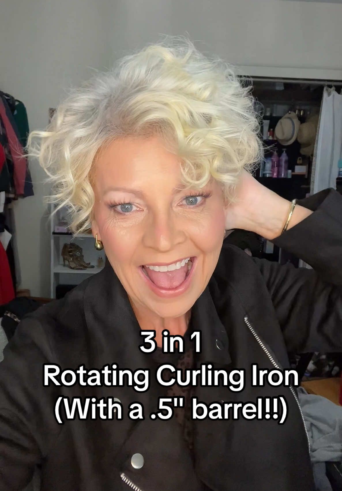 A rotating curling iron that gives 3 interchangeable barrel sizes... and one is a .5