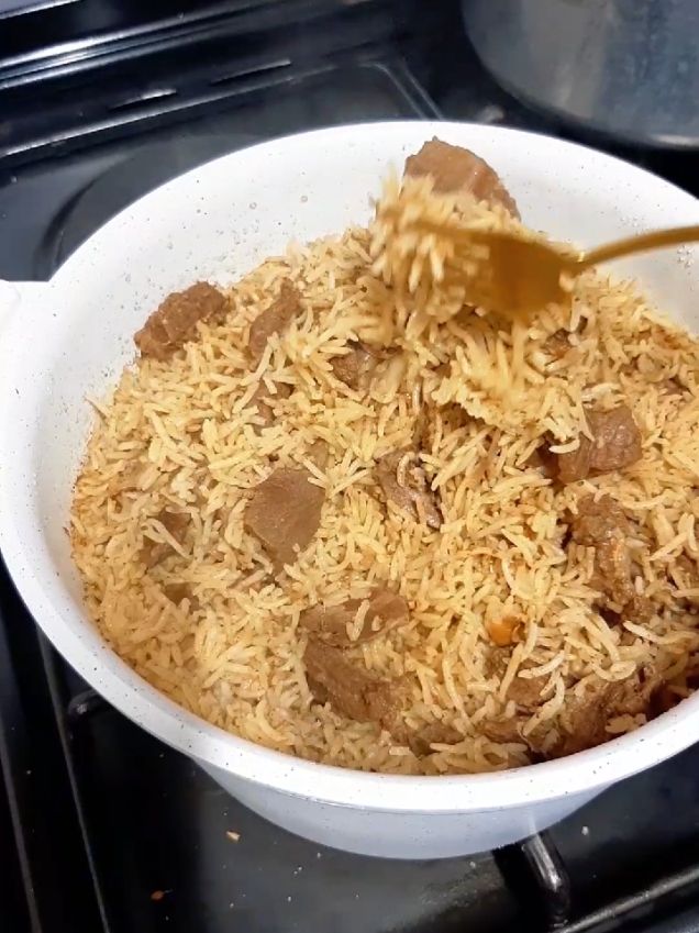 Beef Pilau Recipe *Ingredients* Meat 1 cup rice 2 large onions 1 tsp Ginger/Garlic paste 1 tbsp (heaped) pilau masala preferably homemade Salt & black pepper *PROCEDURE* 1. Boil the meat with enough water and salt until tender. 2. Towards the end of the boiling, wash your rice until water becomes clear (itafanya iive moja moja). Then soak rice for 15-20 mins. 3. The meat has boiled. Separate the meat and water (broth) and set aside. 4. Heat cooking oil in a sauce pan. Fry onions and ginger/garlic paste under low heat until golden brown. Not burnt. 5. Add the boiled meat and masala. Cover and let them brown further. 6. Add the drained rice and 2 cups of broth. Taste and add salt as needed. Sprinkle a bit of sugar to balance everything. 7. Cover with foil paper and cook on low heat. 8. Check that all the water has dried. Turn off heat, cover the pan for 10 minutes for the Pilau to set. 9. Serve hot with accompaniment of choice #pilau #pilaumasala #tiktokkenya #recipesoftiktok