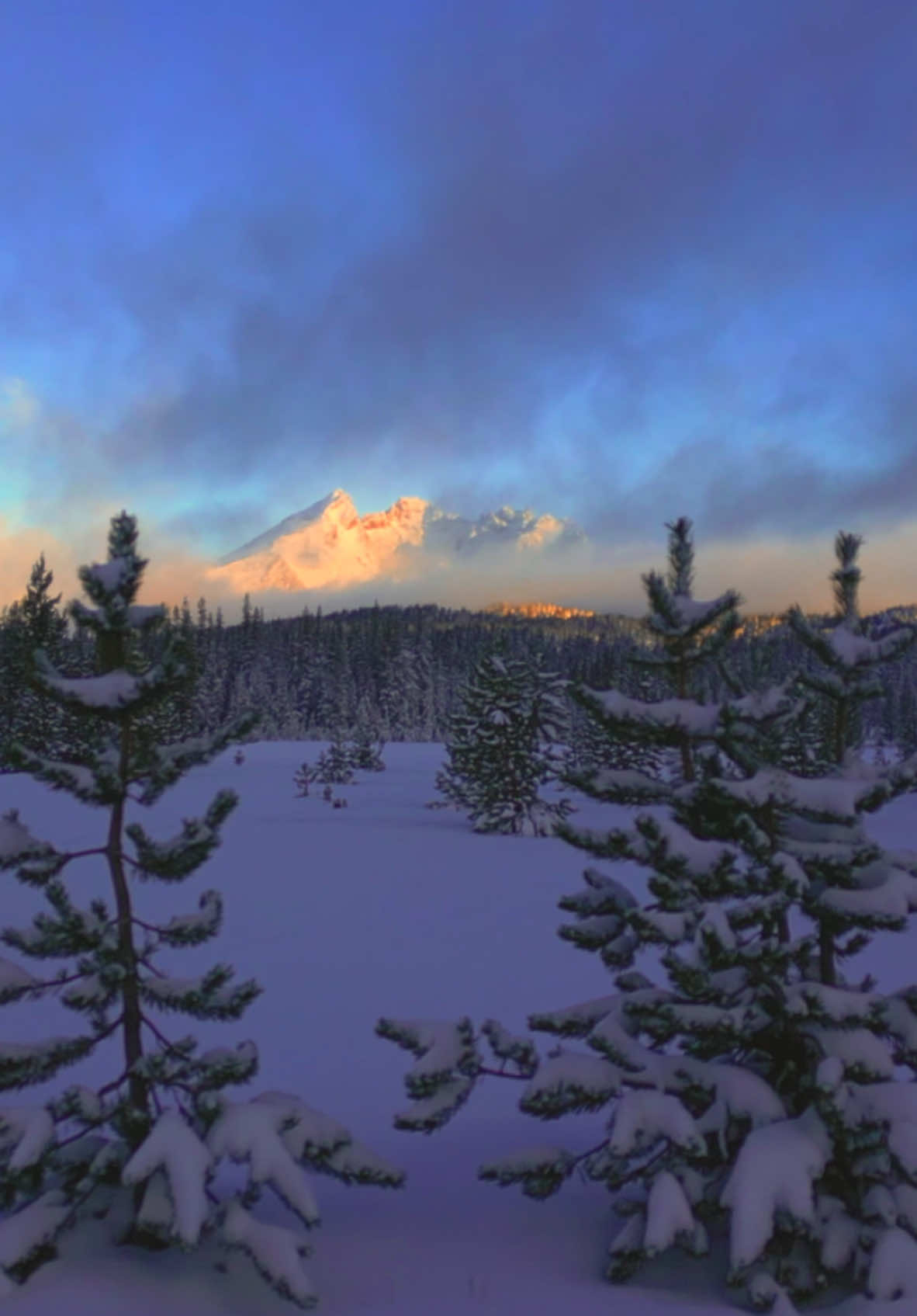 Catching the first light on a magnificent mountain in the distance, surrounded by a breathtaking winter wonderland—a moment of pure magic 🤩 #nature #Outdoors #cinematic #calm #winter 