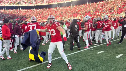 Michigan tried to plant the flag again at midfield, Jack Sawyer ripped it off and threw it.