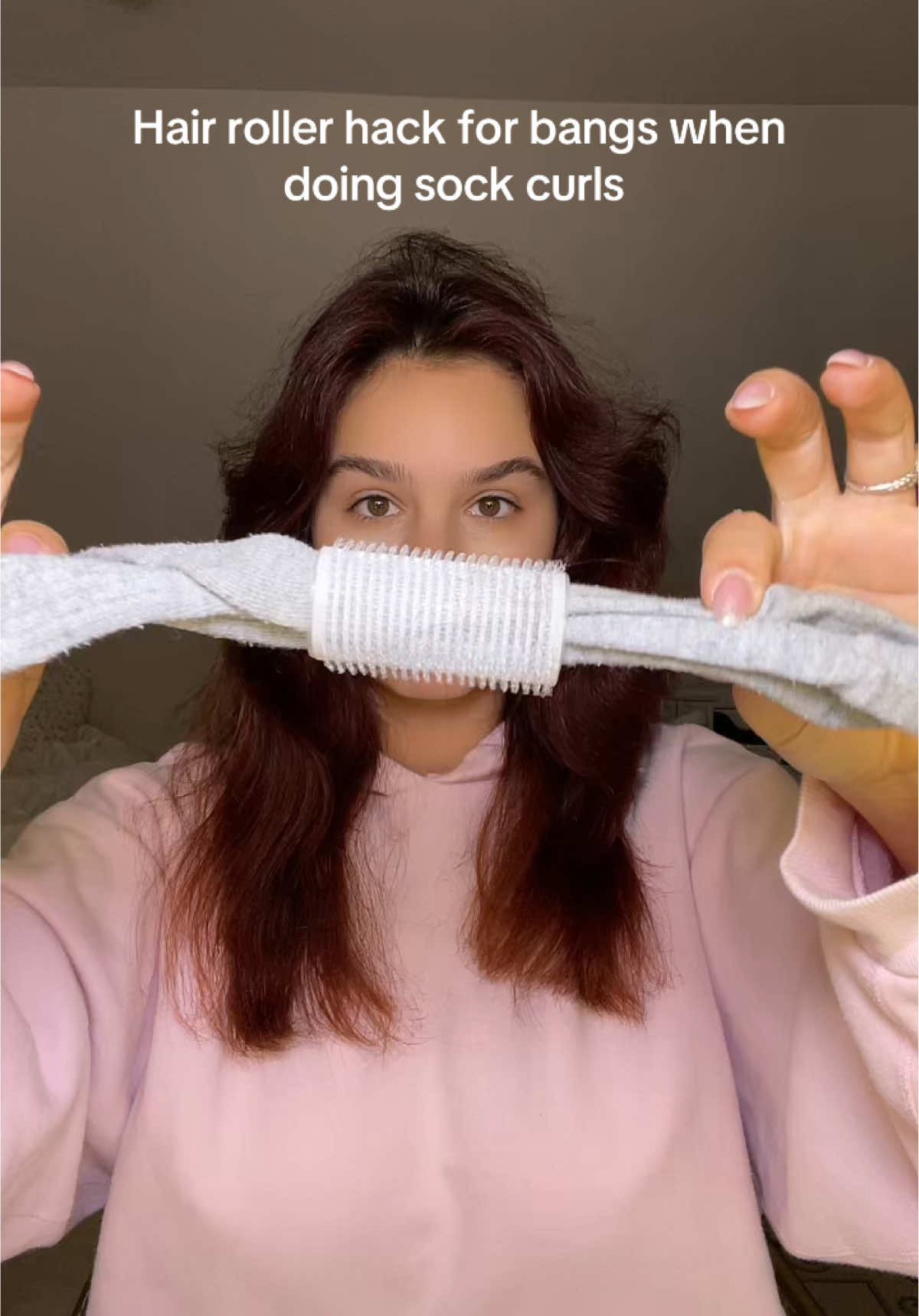 For the girlies with bangs, try a roller with a sock inside for comfort when sleeping in sock curls 💗 #sockcurls #heatlesscurls #sockcurltutorial #sockcurlbangs #bangs #layeredhair #heatlesshairstyle #sockcurl #hairhacks #hairhack 