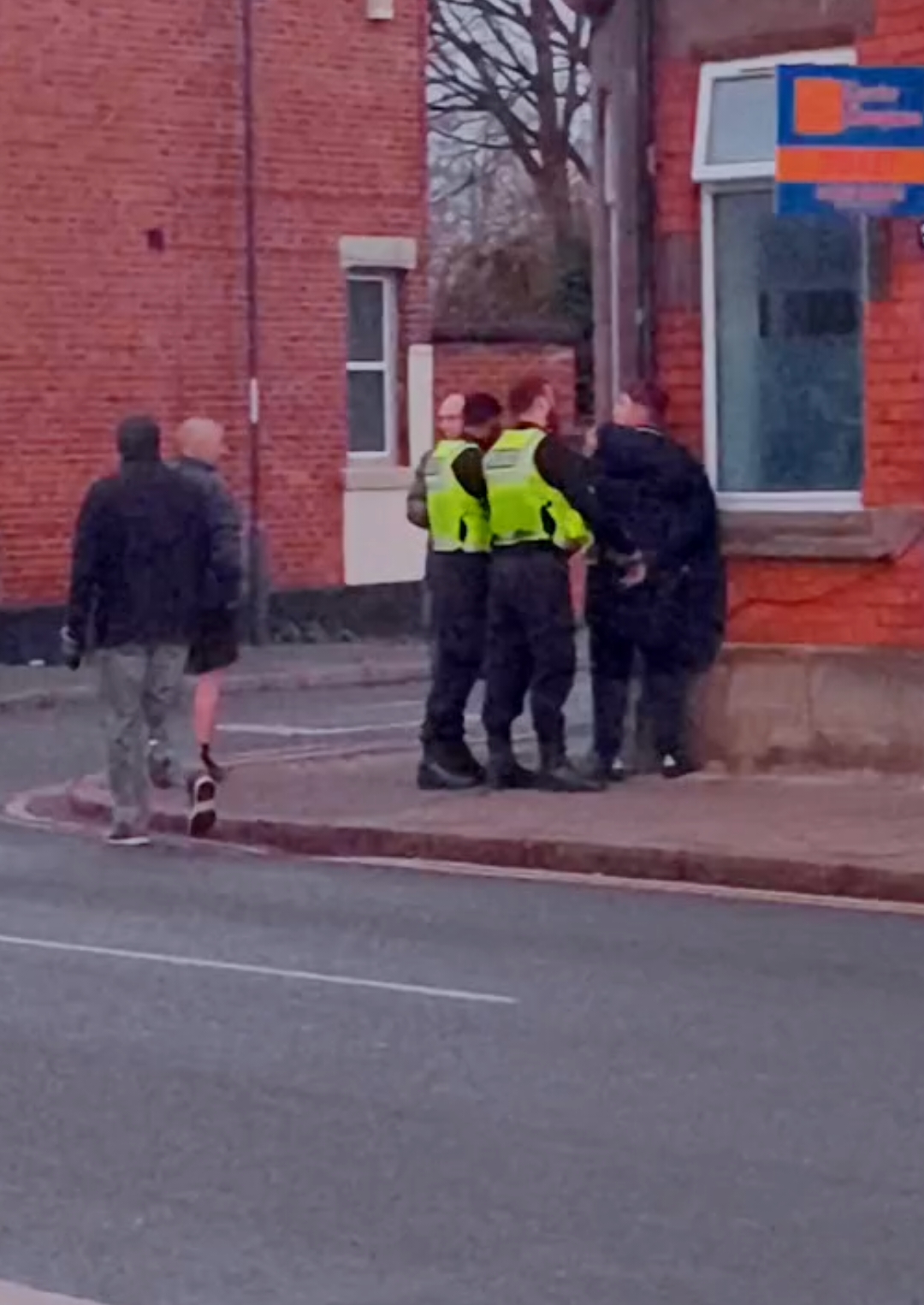 NORMANTON police incident with agitated onlookers - man in handcuffs led away by cops 