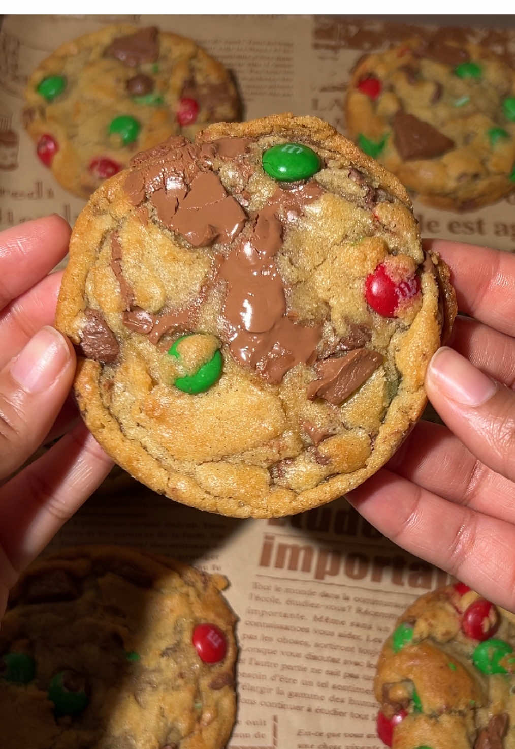 It’s finally December! Make Christmas m&m cookies with me 🎄🫶🏽🧈 full recipe below!  Ingredients - 1/2 cup unsalted butter, melted  - 3/4 cup brown sugar - 1/2 cup granulated sugar  - 1 large eggs - 2 tsp vanilla extract -  1 1/4 cups all-purpose flour - 1 tsp cornstarch  - 1/2 tsp baking soda - 1/2 tsp salt - 2/3 cup red and green Christmas M&M's - 1/2 cup milk chocolate chips - 1/2 milk chocolate chunks, half in dough half for topping before baking Instructions  - In a large mixing bowl, mix together the melted butter, granulated sugar, and brown sugar until combined - Add egg, mix until combined. Then, mix in the vanilla extract. - In a separate bowl, whisk together the all-purpose flour, cornstarch, baking soda, and salt. Gradually add the dry ingredients to the wet ingredients, mixing until just combined. Be careful not to overmix. - Gently fold in the chocolate chips, chocolate chunks, and M&M's, reserving a small handful of M&M's and chocolate chunks for topping the cookies later. - Use a cookie scoop to drop rounded balls of dough onto the prepared baking sheets, spacing them about 2 inches apart. Press a few reserved M&M's and chunks on top of each cookie dough ball. Refrigerate for minimum of two hours - 1. **Preheat the oven** to 350°F (175°C). - Bake in the preheated oven for 10-12 minutes, or until the edges are lightly golden, and the centers are still soft. Use a round cookie cutter to make them perfectly circular. Allow cookies to cool and enjoy! • • #christmasbaking #cookierecipe #baketok #christmascookies #fyp  #creatorsearchinsights 