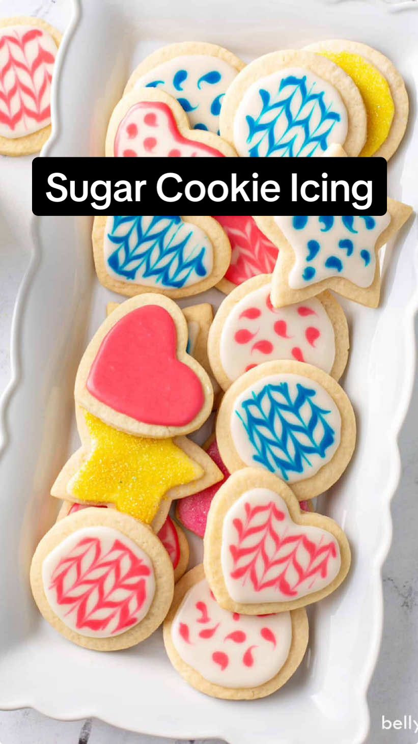 This sugar cookie icing recipe is perfect for decorating all your holiday cookies! It tastes great and hardens so you can stack your cookies. Leave it plain or choose your colors. #cookieicing #icingcookies #icing 