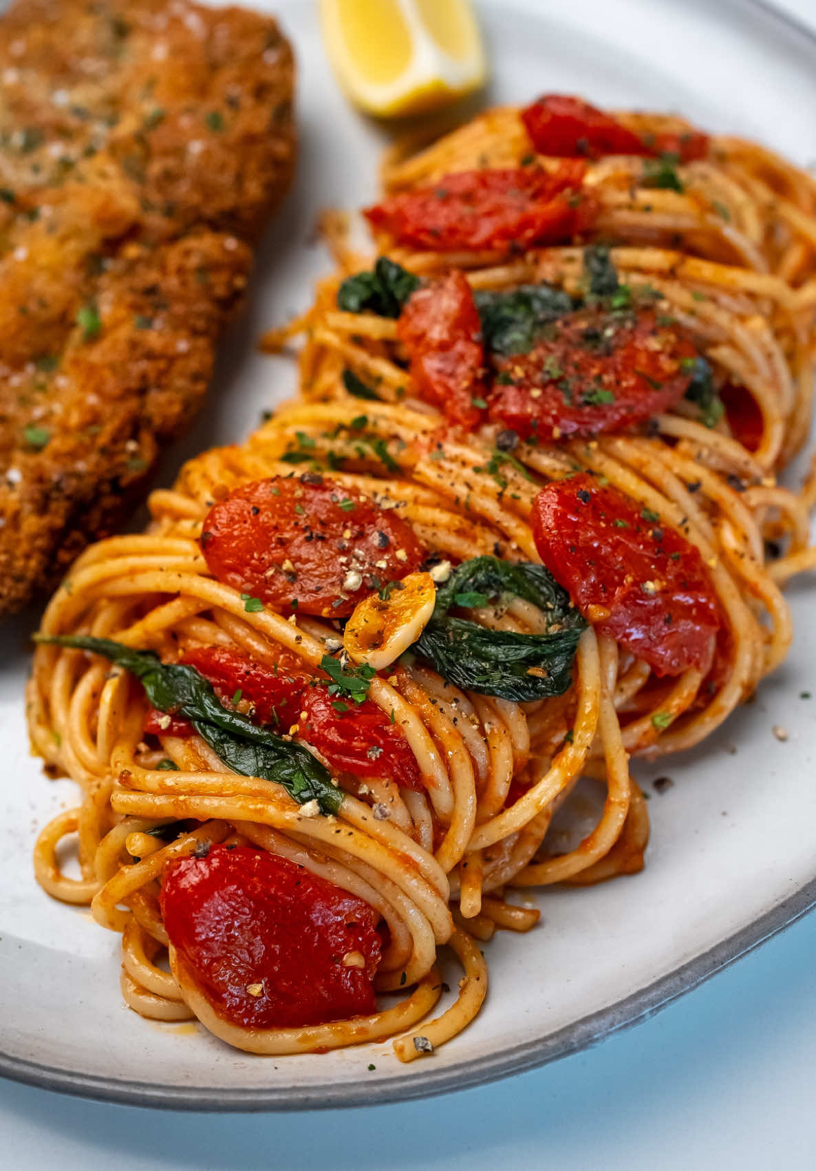 Cherry Tomato Spaghetti with Fried Chicken Cutlet This dish brings together two of my favorite things: spaghetti in a rich tomato and garlic sauce paired with crispy fried chicken. It’s a nostalgic nod to my childhood, where a simpler version of this meal was always a favorite. Now, I’ve added a few elevated elements to create the perfect balance of flavors that feels both comforting and special. Find the full recipe at the link in my bio! Enjoy! 😊 #EasyRecipes #californiafoodies #comfortfood #spaghetti  Easy dinner recipes How to make chicken cutlet Fried chicken Dinner ideas Winter meal ideas