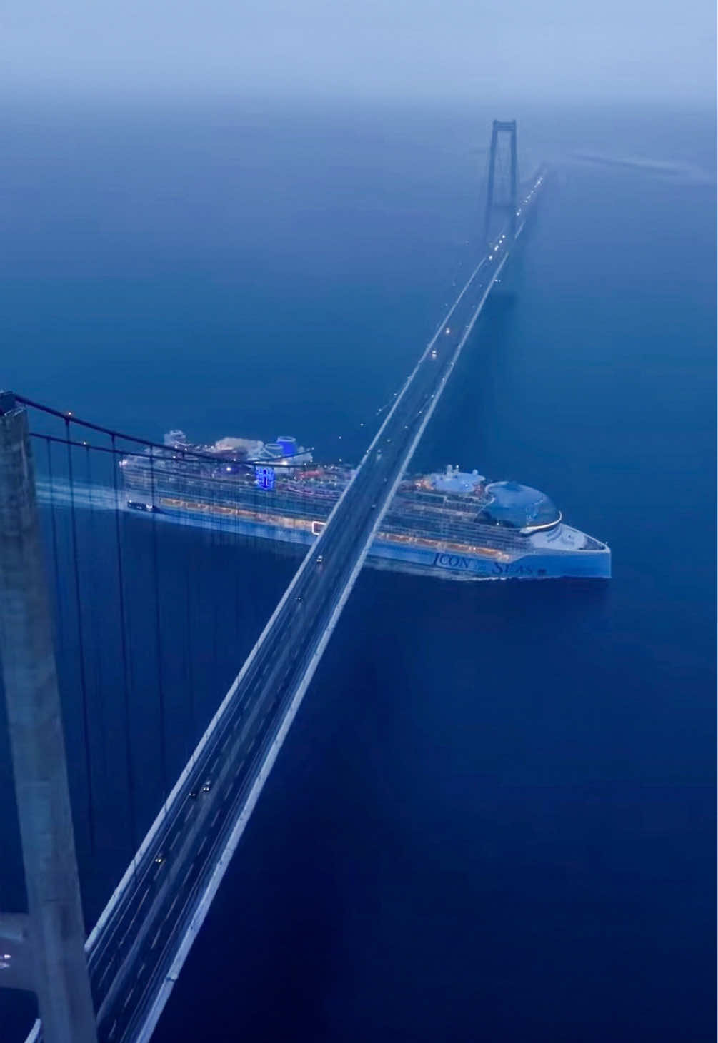 One year later, still iconic – Watch the world's largest cruise ship #IconoftheSeas pass this bridge with just a few meters of clearance! 😱⚓️ 📍Great Belt Bridge, Denmark #RoyalCaribbean #cruise #cruiseship #travel #denmark #bridge  