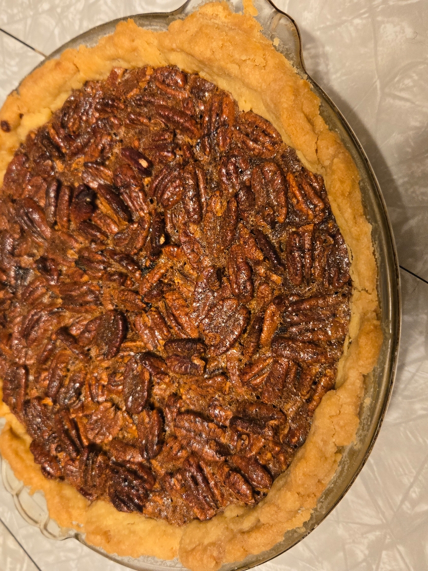 Homemade pecans pie with homegrown pecans. All from scratch, absolutely delicious. Enjoy peeks of my little helper 🥰 #food #baking #foodphotography #homemade #baby #momlife #pie #pecan #dessert #homestead #homesteading #toddler #toddlerlife #adorable #mess #bakinglove #scratchcooking 