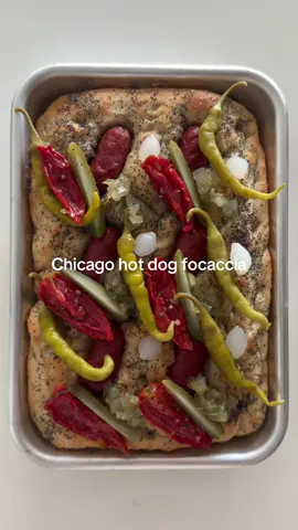 Chicago hot dog focaccia with a twist: poppyseed and celery salt crusted focaccia with bb  dawgs, cocktail onions, marinated roasted tomatoes, cornichon spears, relish, piparra peppers and mustard squiggles  