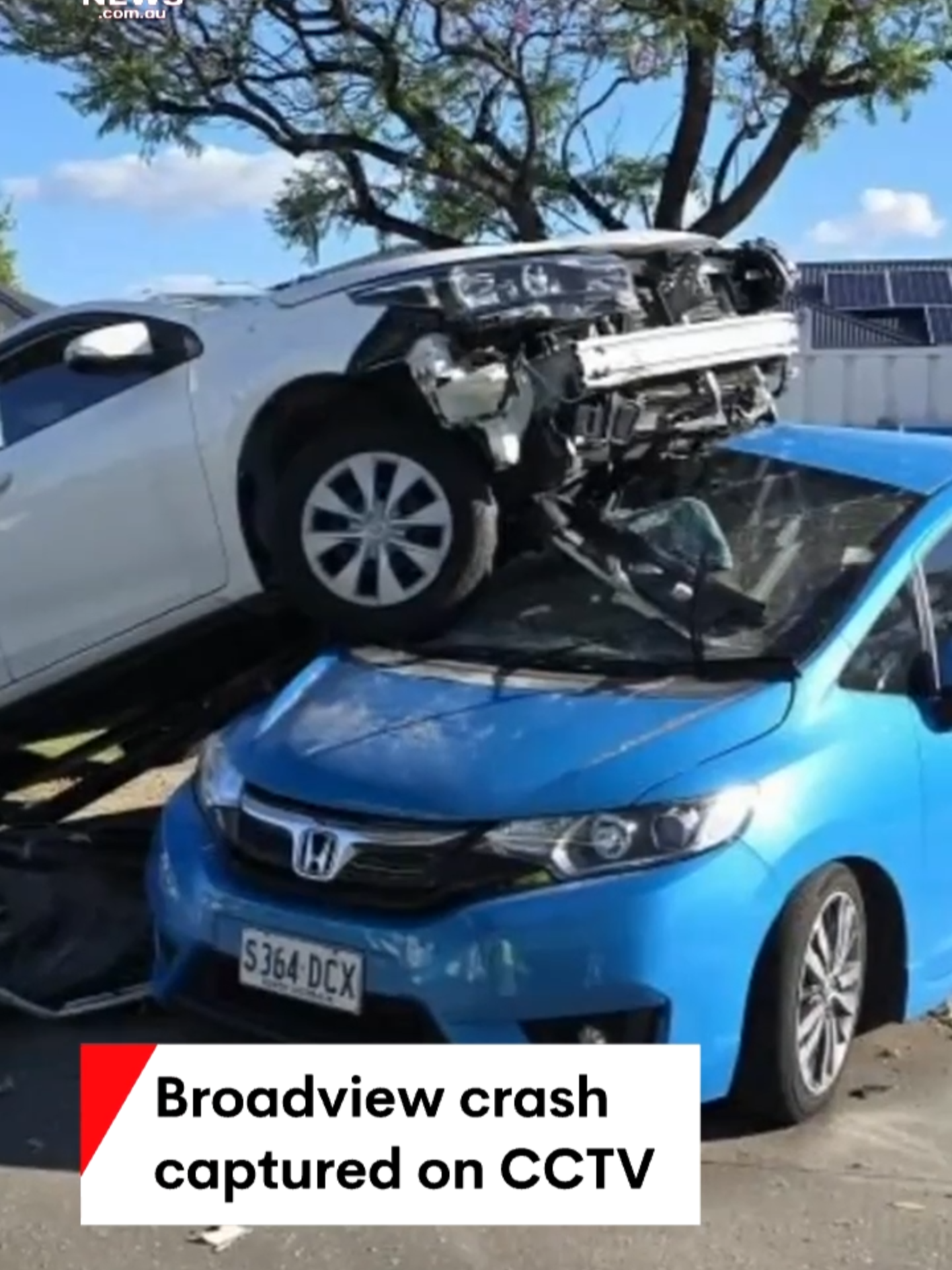 An out-of-control car has ended on top of another in a dramatic crash at a Broadview service station. CCTV shows the white sedan being struck while turning off Hampstead Road, veering off course and ploughing into a sign before landing on the parked hatchback. #carcrash #crash #Adelaide #Broadview #7NEWS