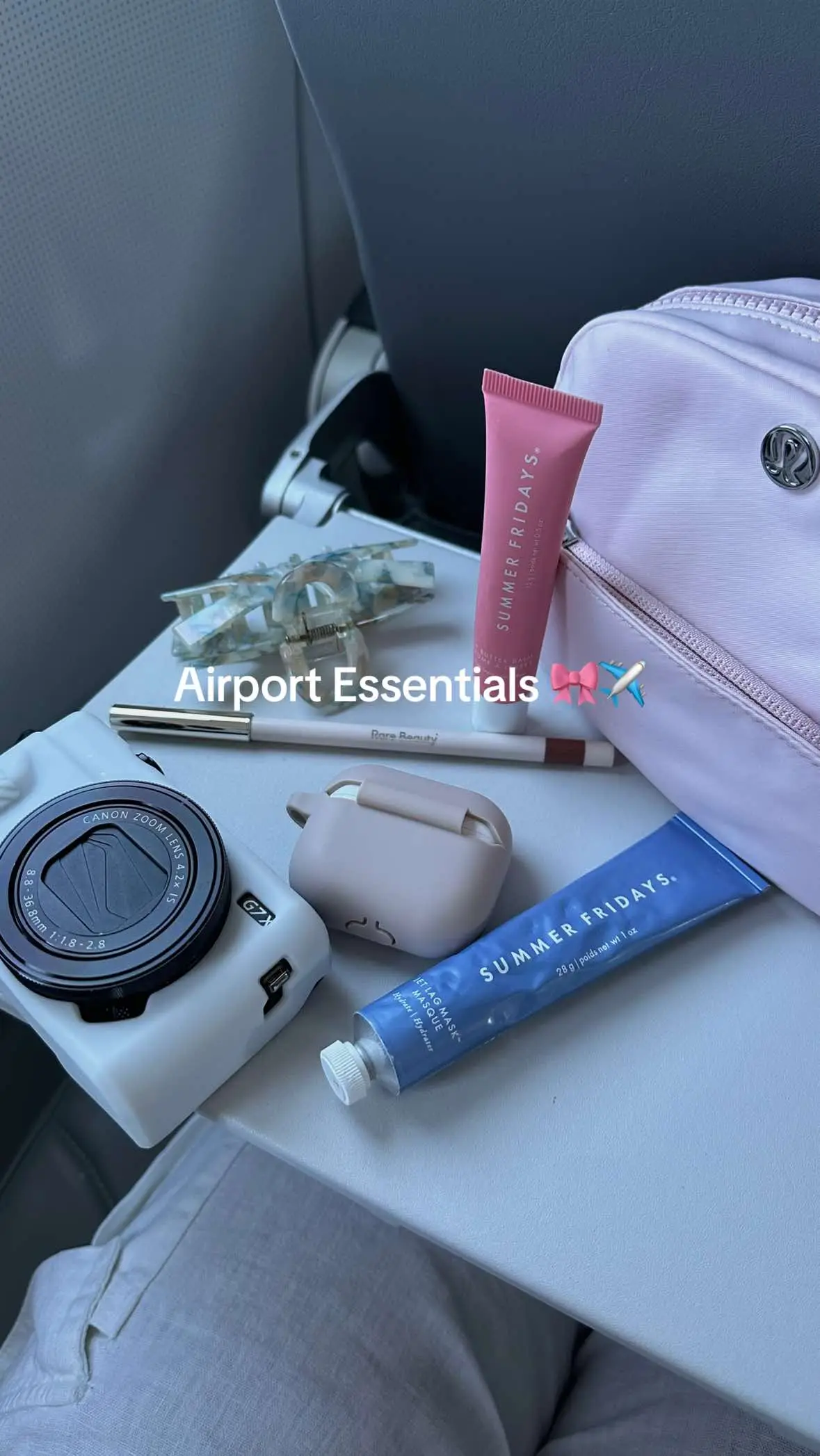 my essentials for travel 🤍  @Summer Fridays jet lag mask and lip butter balm in pink sugar @lululemon city essentials mini pouch in flush pink @canonusa g7x mark ii @Rare Beauty lip liner in wise @apple airpods  #airport #travel #traveltiktok #skincare #beauty #camera #creatorsearchinsights 